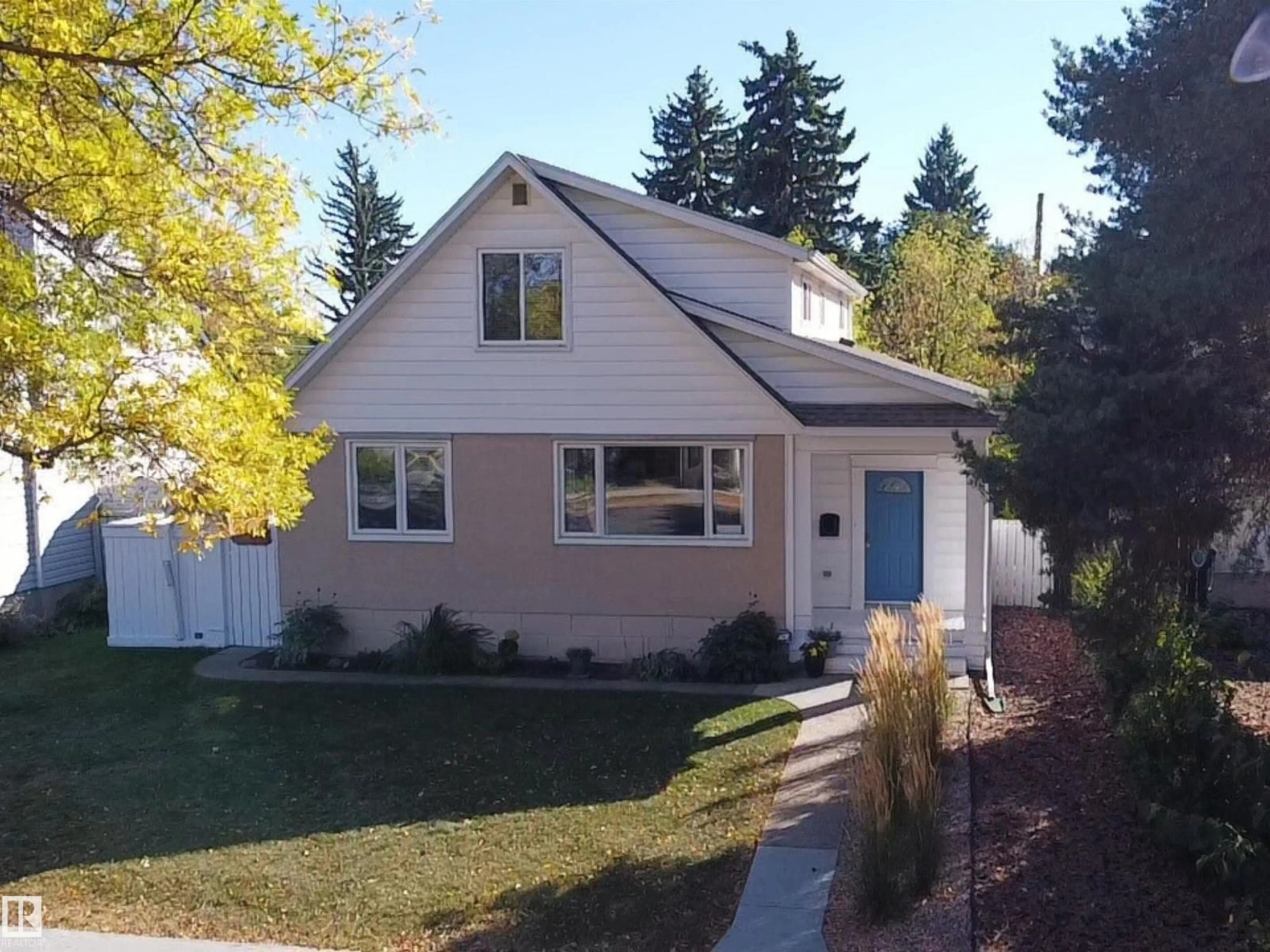 Home with vinyl exterior material, street for 13207 109 AV, Edmonton Alberta T5M2G3