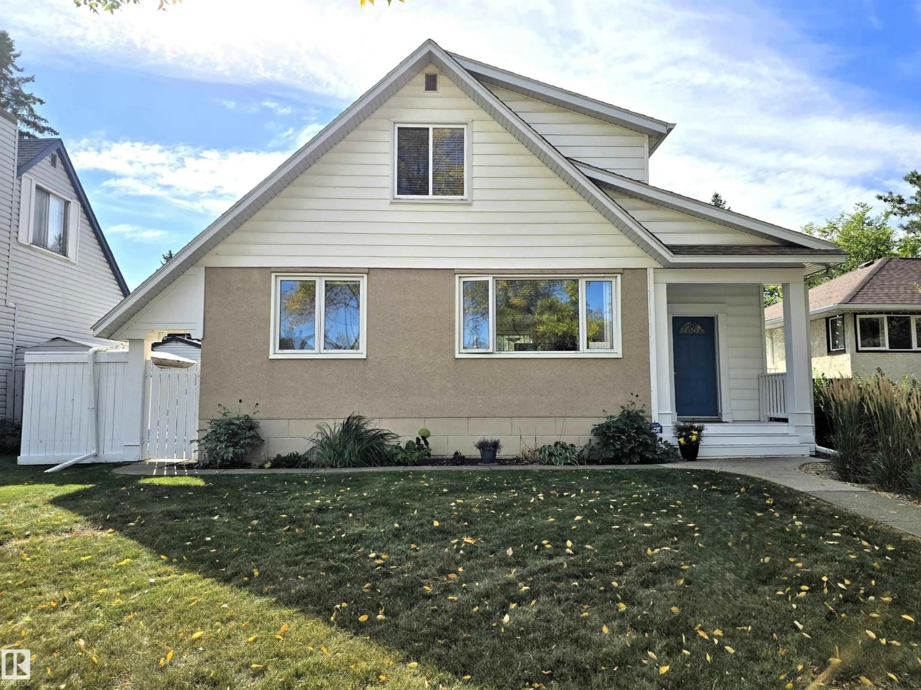 Home with vinyl exterior material, street for 13207 109 AV, Edmonton Alberta T5M2G3