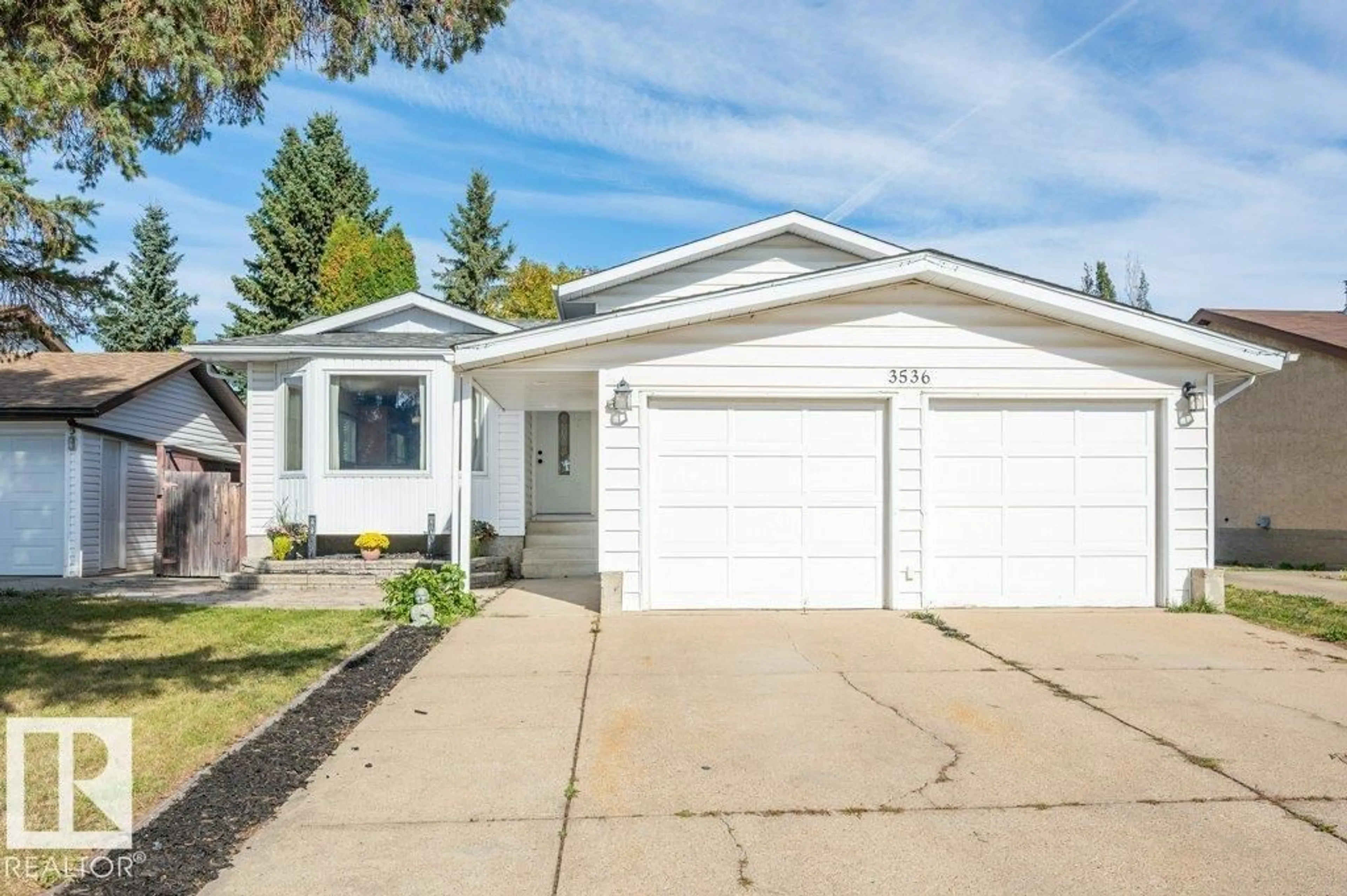 Home with vinyl exterior material, street for 3536 19 AV, Edmonton Alberta T6L2Z9