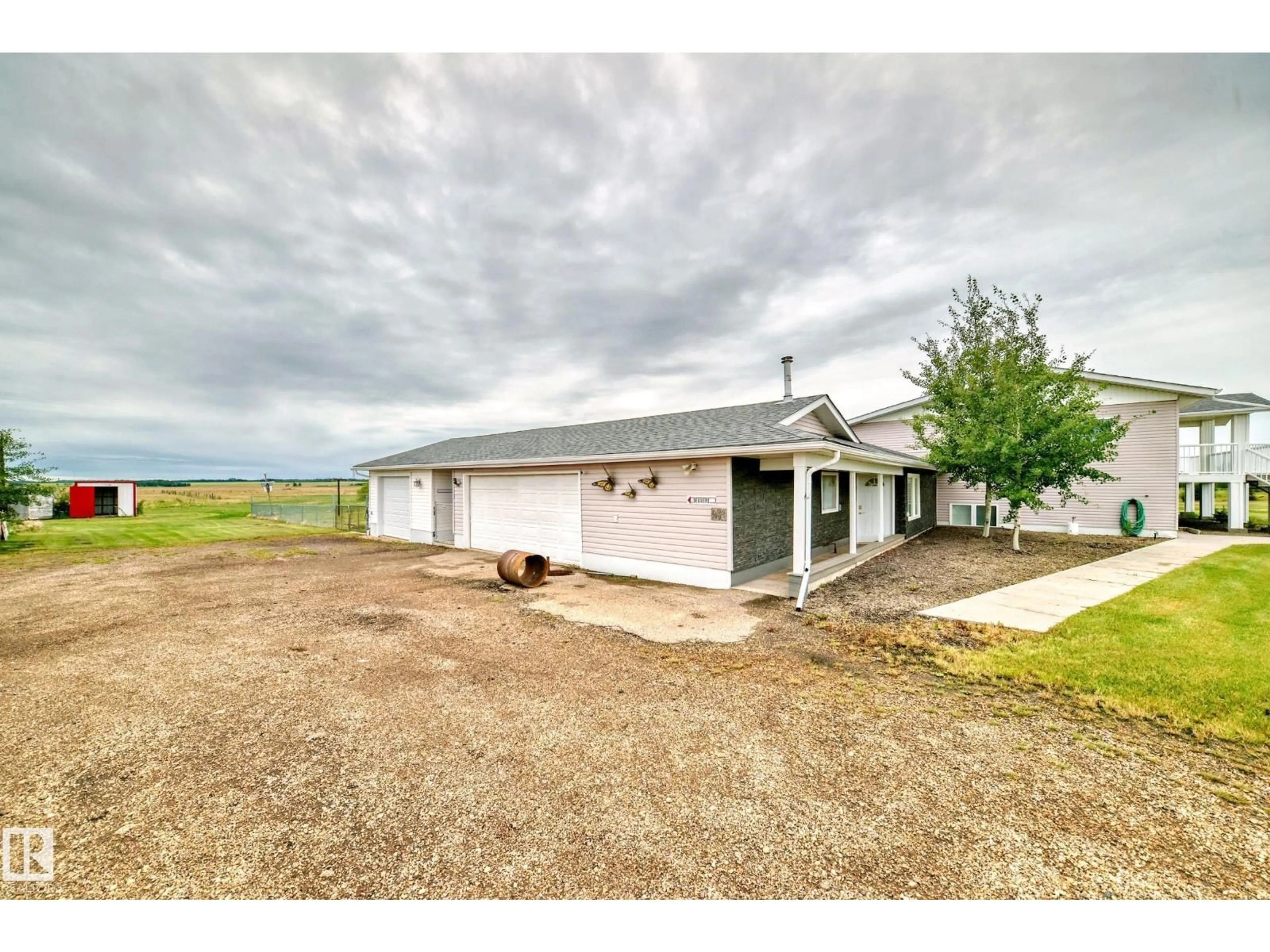 A pic from outside/outdoor area/front of a property/back of a property/a pic from drone, building for 25027 TWP RD 484, Rural Leduc County Alberta T4X2T7