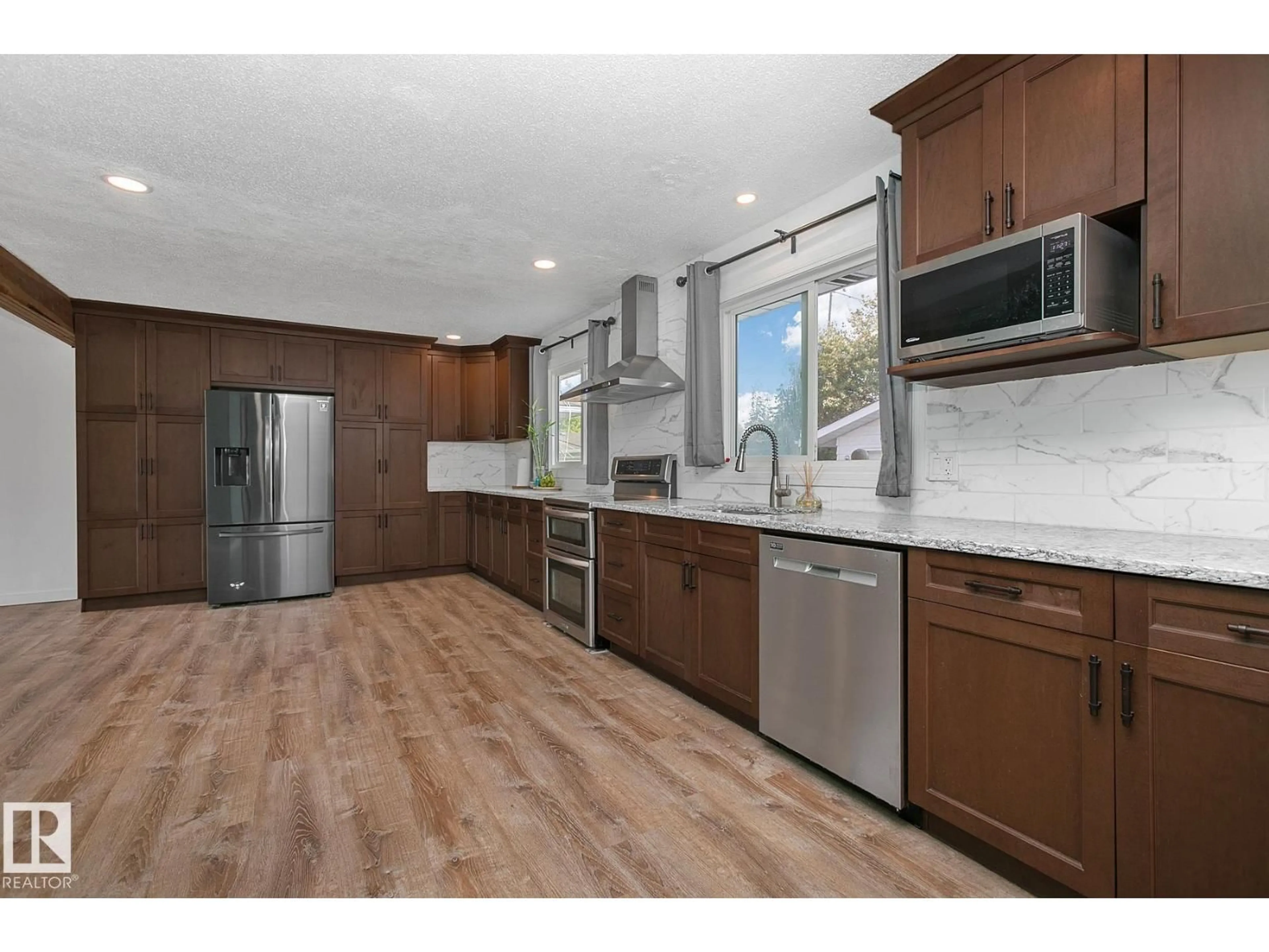 Open concept kitchen, wood/laminate floor for 3 WILSON CR, Sherwood Park Alberta T8A3L1