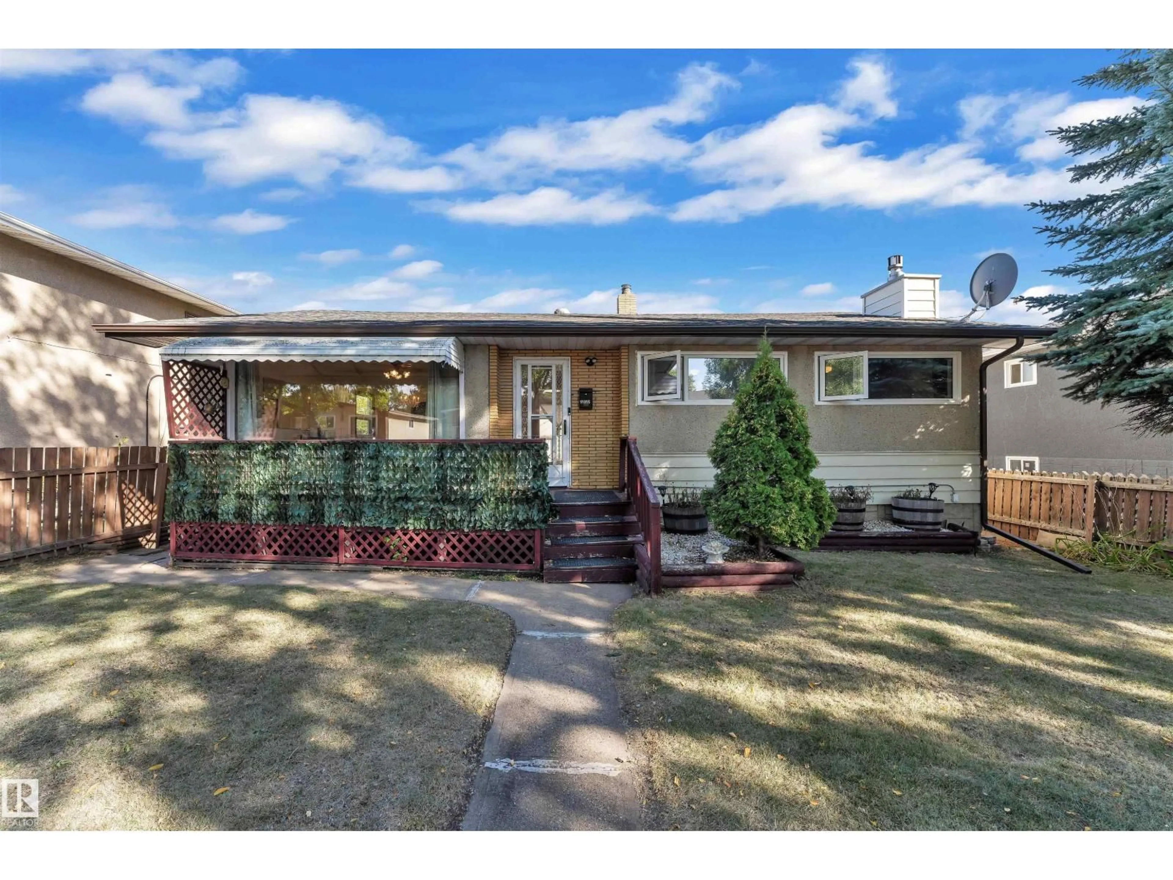 Home with vinyl exterior material, street for NW - 11815 46 ST, Edmonton Alberta T5W2V6