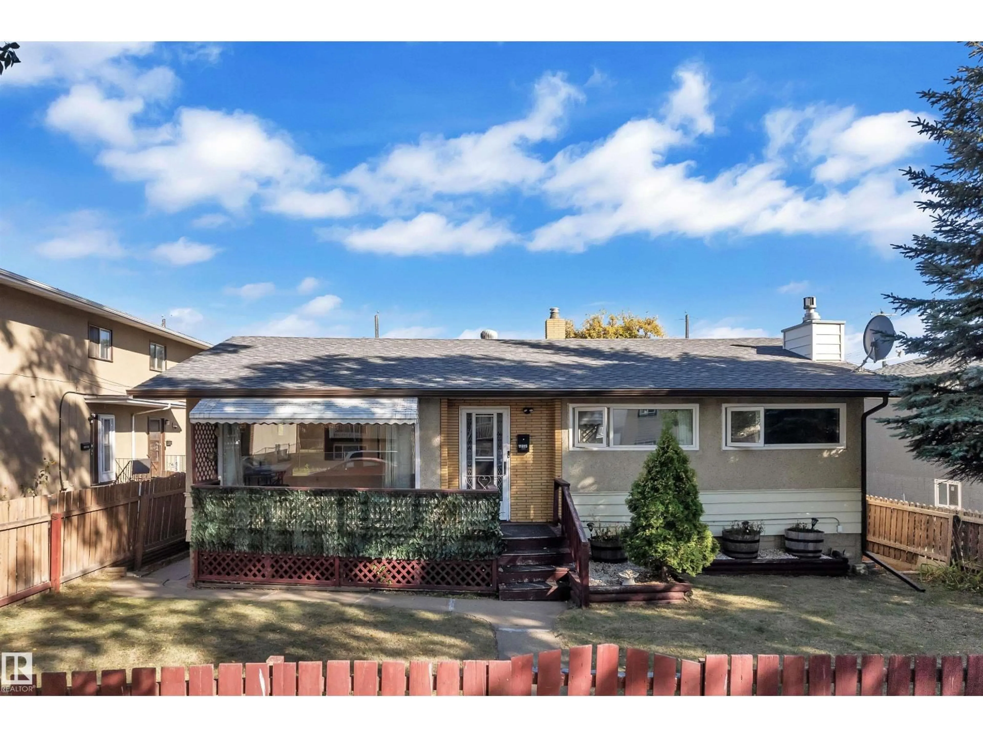 Home with vinyl exterior material, street for NW - 11815 46 ST, Edmonton Alberta T5W2V6