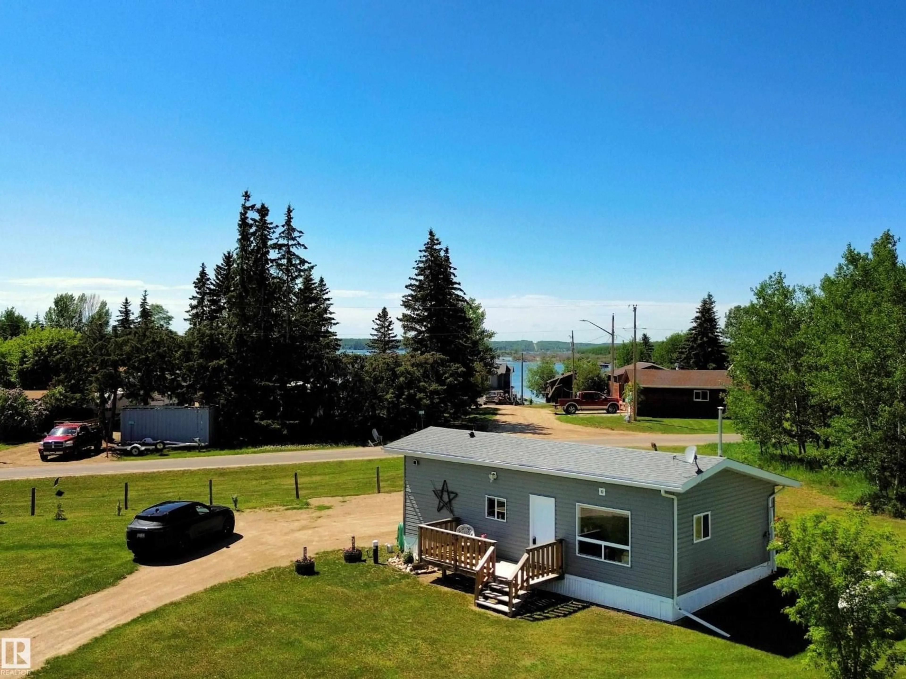 A pic from outside/outdoor area/front of a property/back of a property/a pic from drone, water/lake/river/ocean view for 106 - 57730 RANGE ROAD 30, Rural Barrhead County Alberta T0G0H0