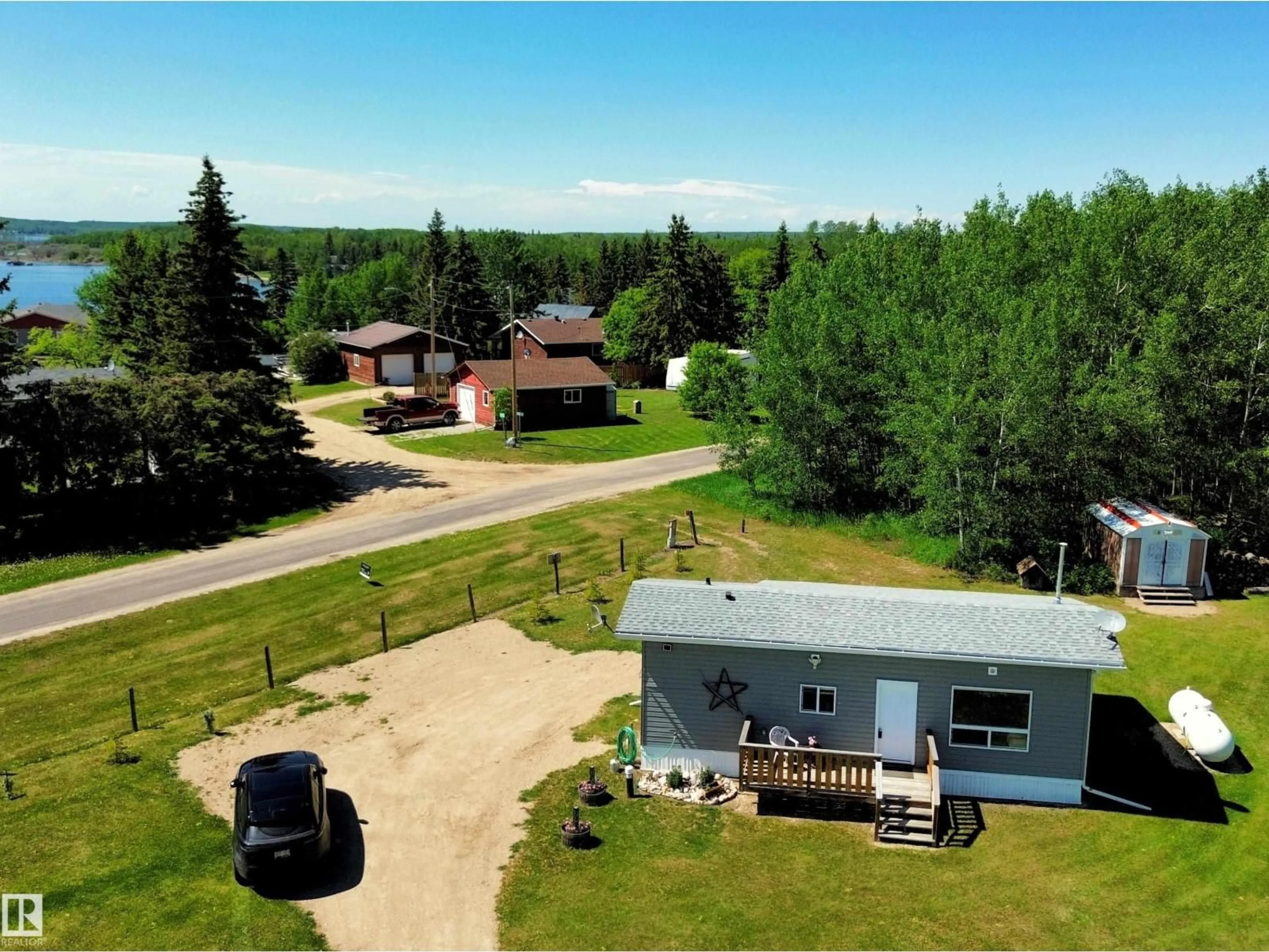 A pic from outside/outdoor area/front of a property/back of a property/a pic from drone, unknown for 106 - 57730 RANGE ROAD 30, Rural Barrhead County Alberta T0G0H0