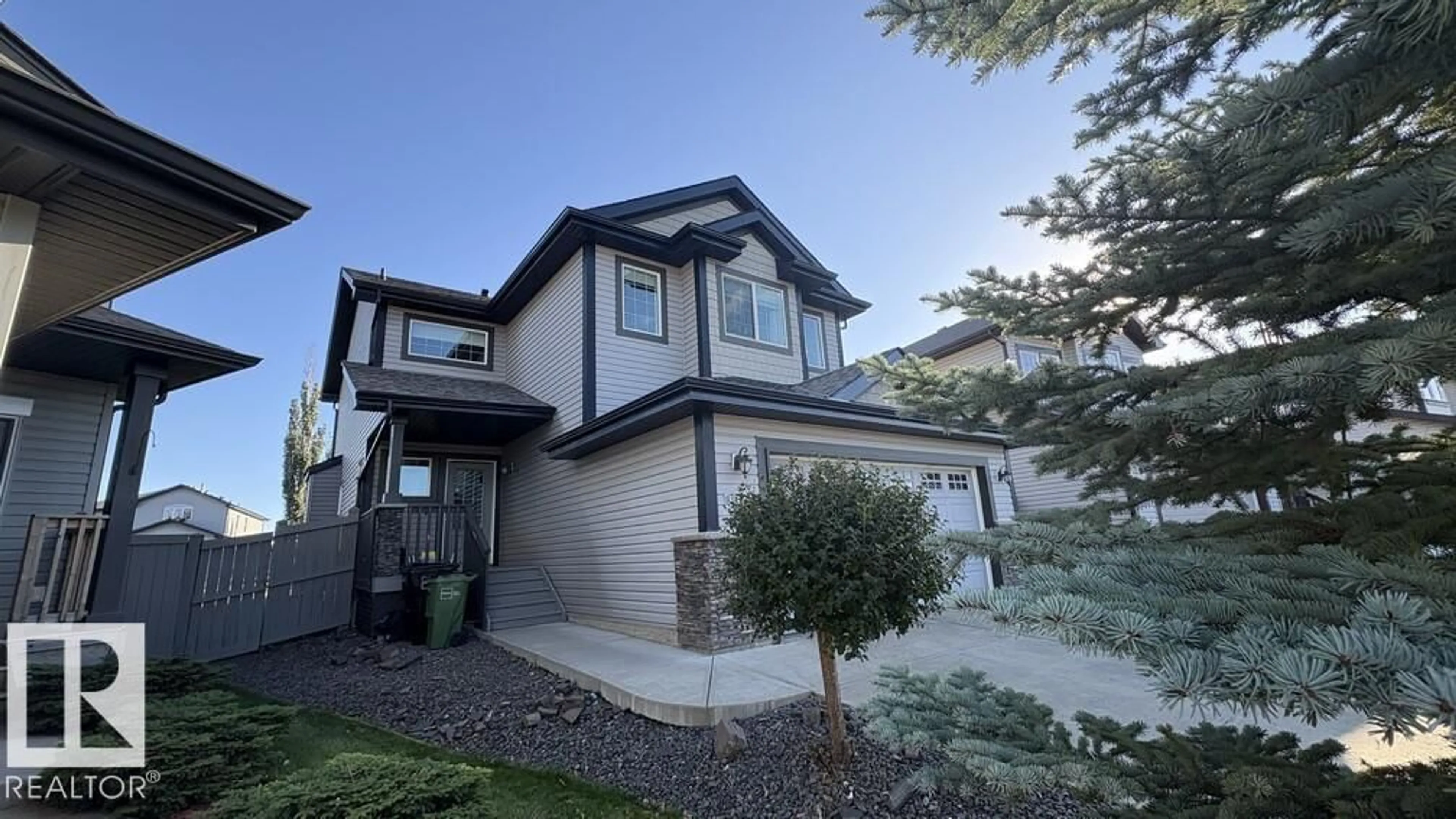 Home with vinyl exterior material, street for SW - 11441 14A AV, Edmonton Alberta T6W0N3