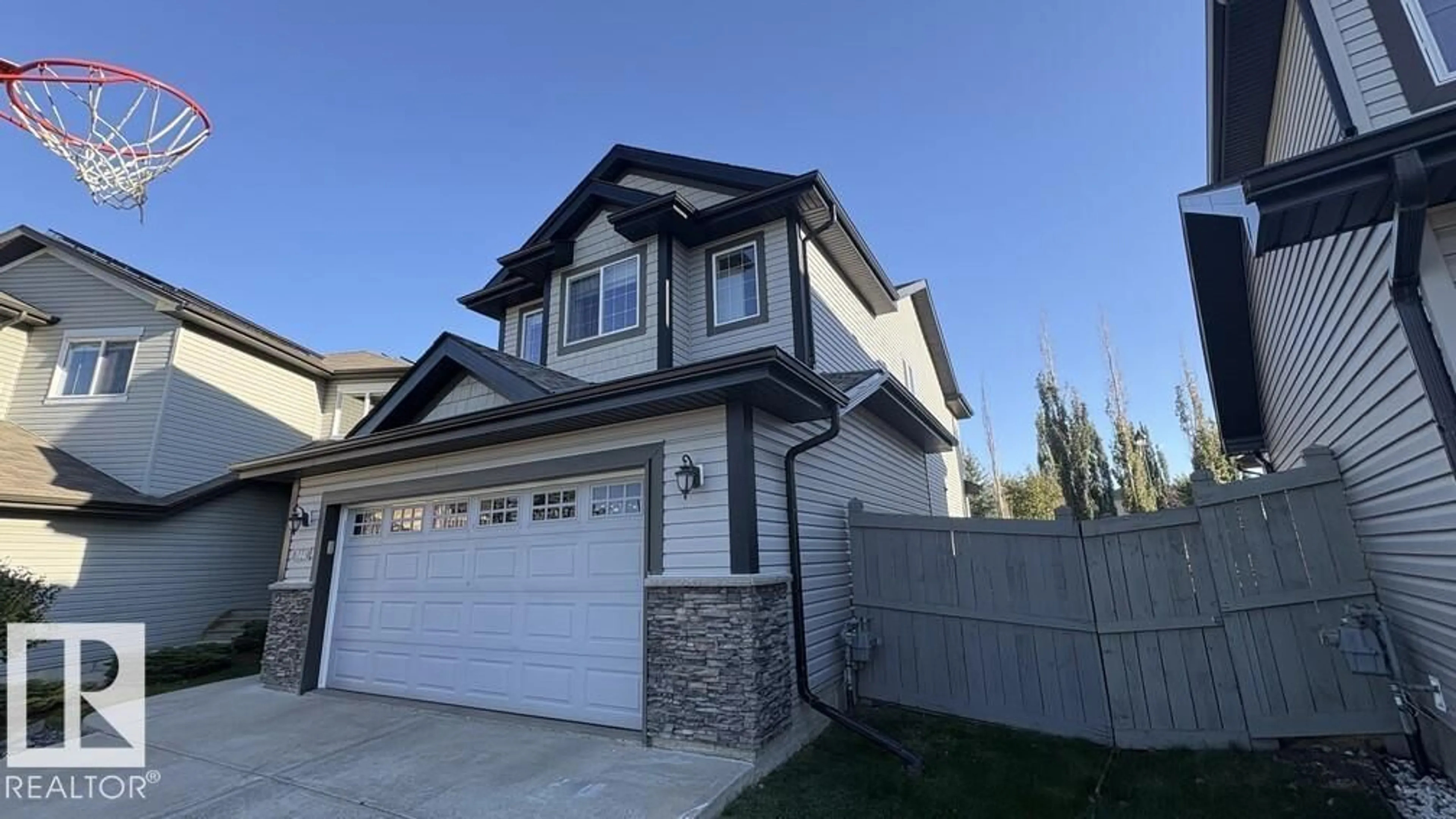 Home with vinyl exterior material, street for SW - 11441 14A AV, Edmonton Alberta T6W0N3