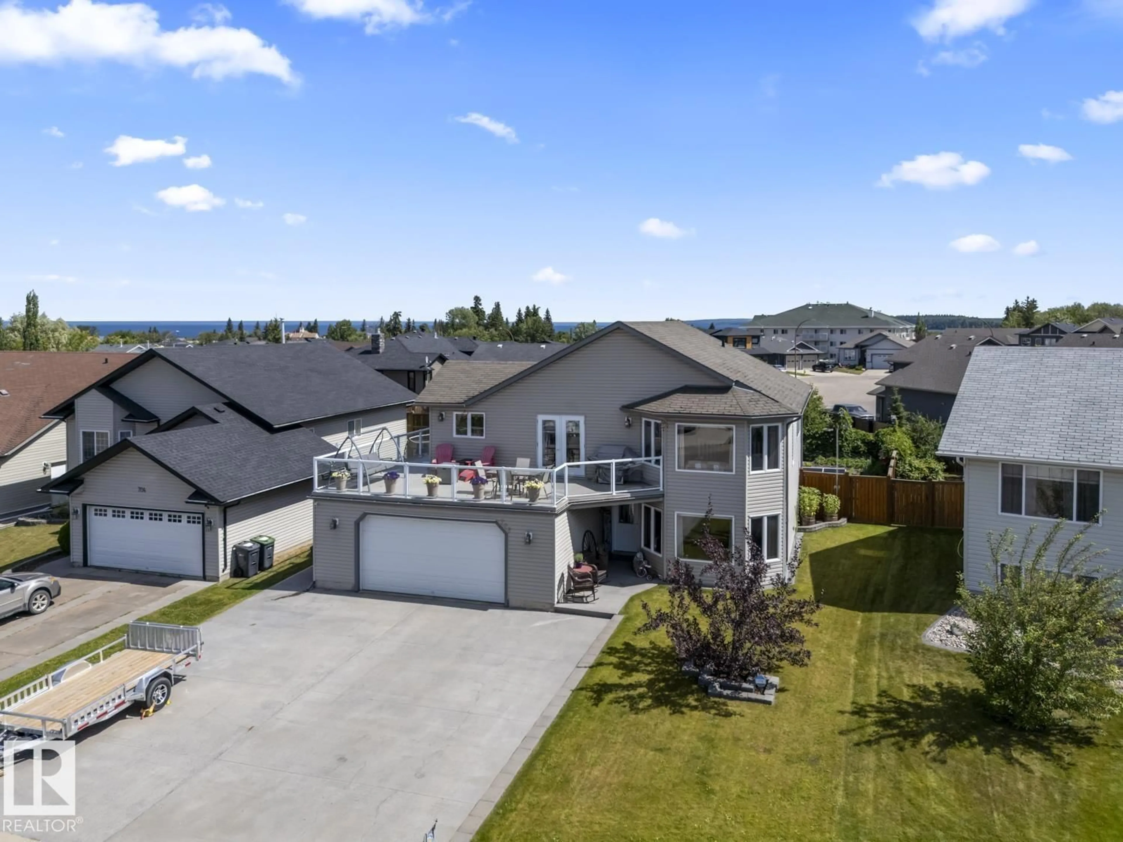 A pic from outside/outdoor area/front of a property/back of a property/a pic from drone, water/lake/river/ocean view for 706 GROUSE CL, Cold Lake Alberta T9M0A5