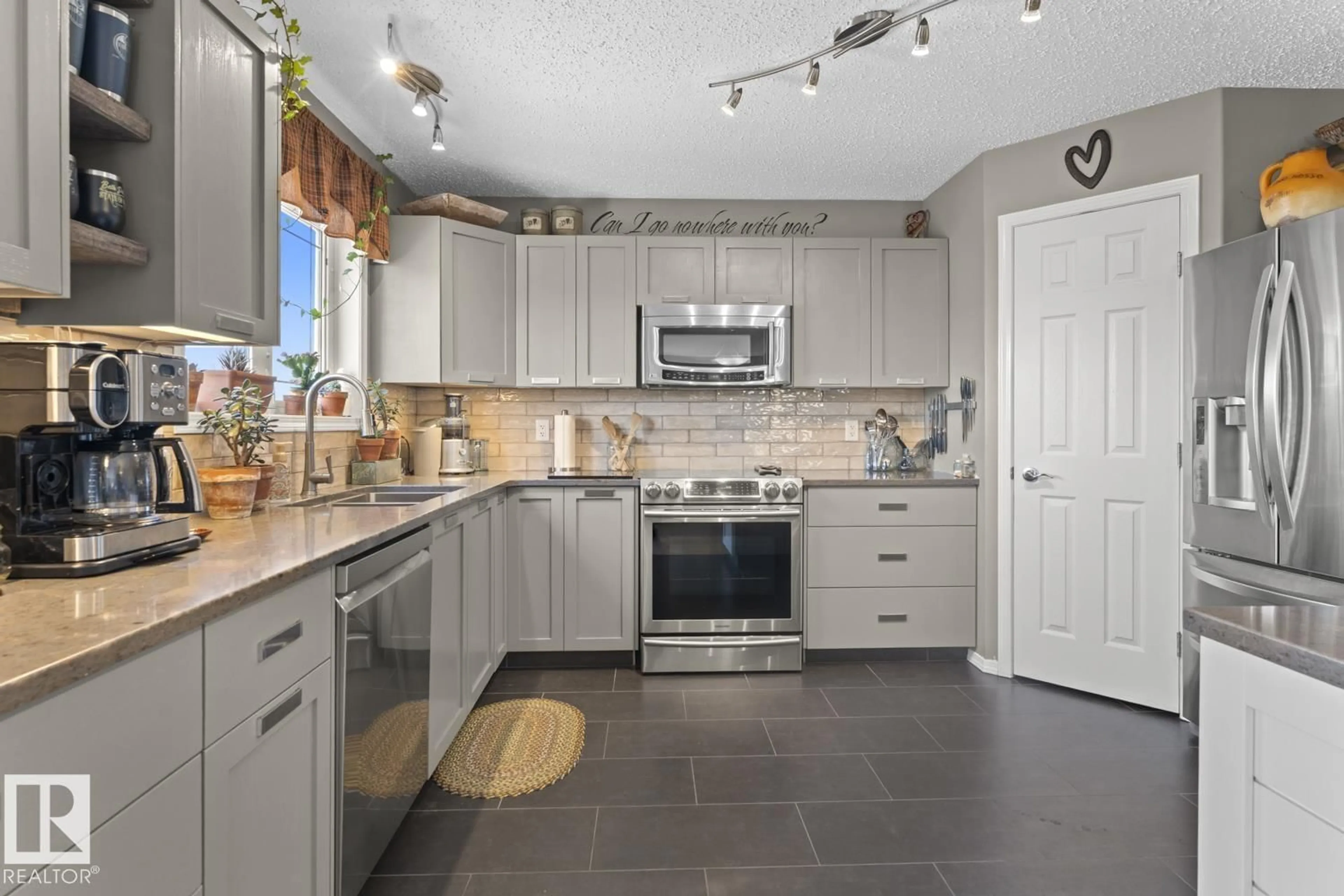 Open concept kitchen, ceramic/tile floor for 706 GROUSE CL, Cold Lake Alberta T9M0A5