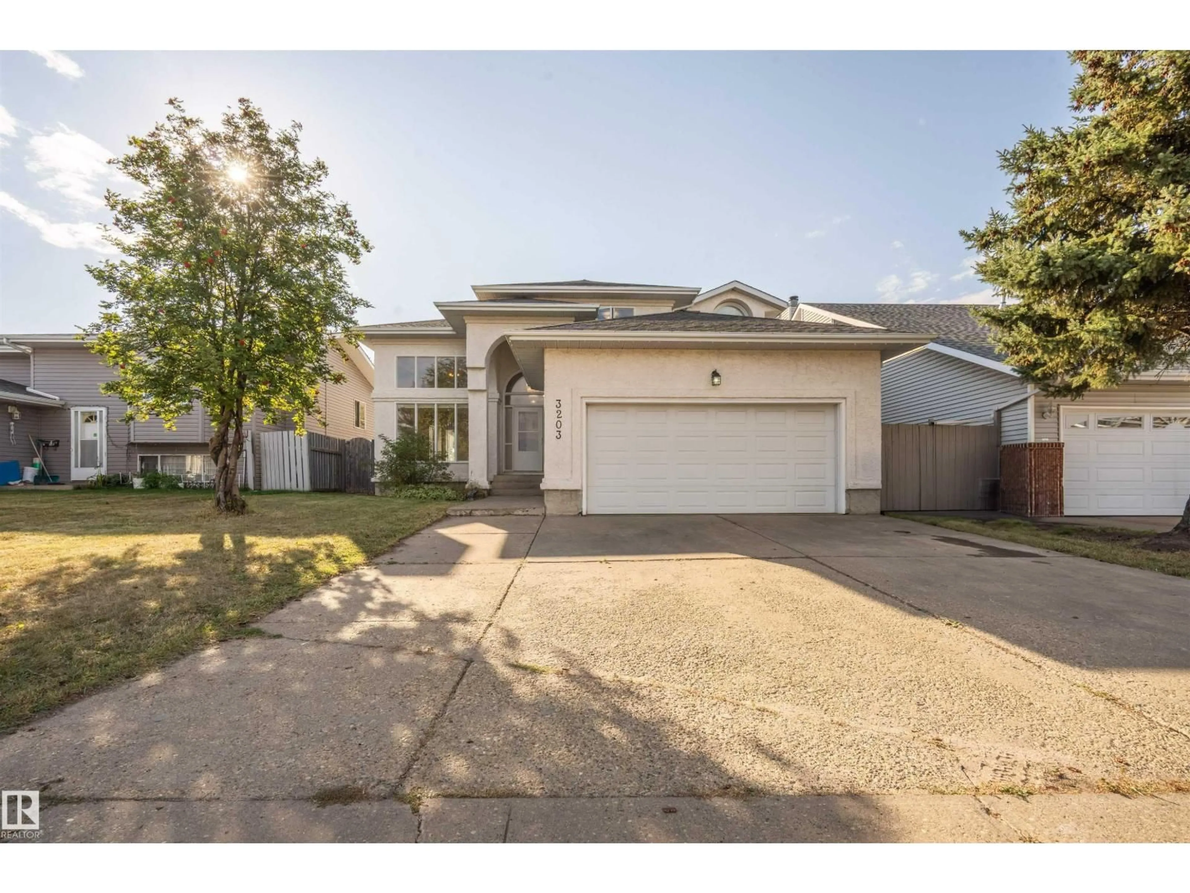 A pic from outside/outdoor area/front of a property/back of a property/a pic from drone, street for 3203 145 AV, Edmonton Alberta T5Y2E9