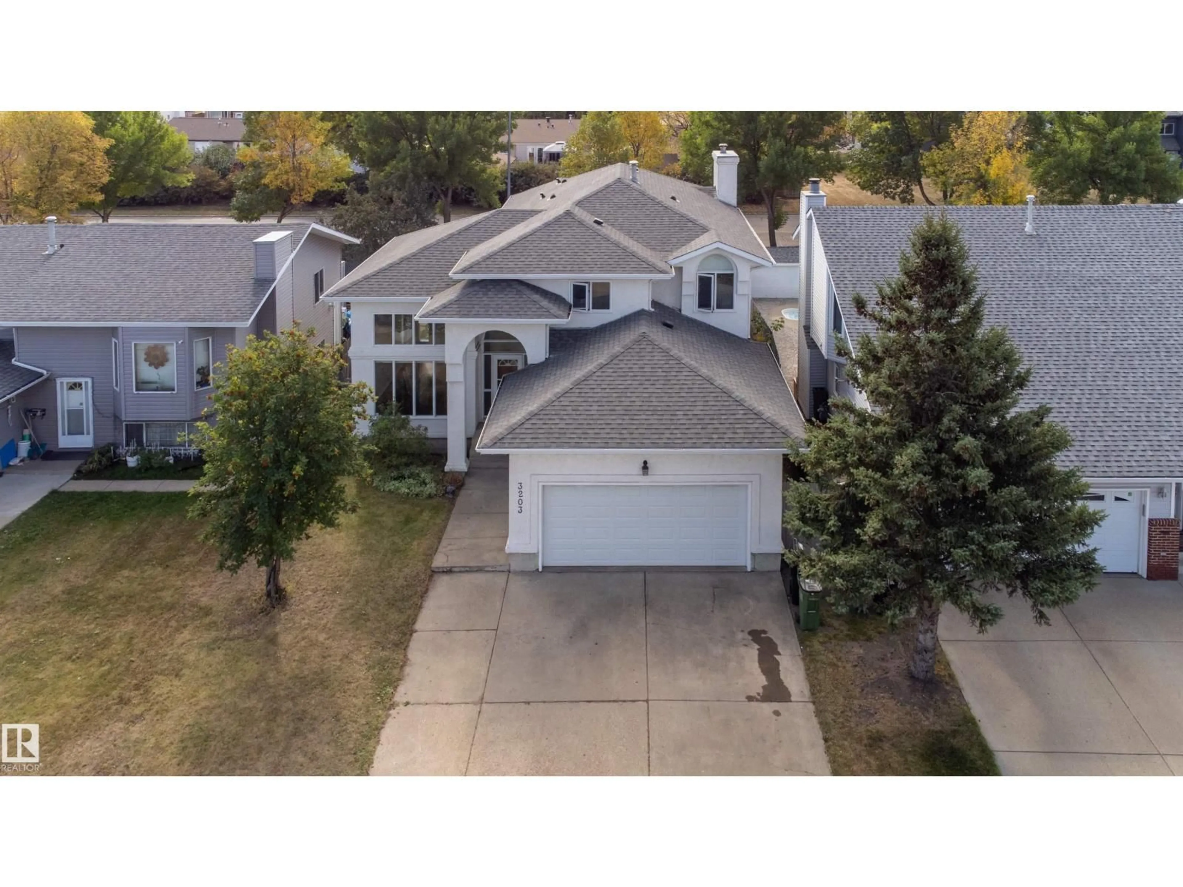 A pic from outside/outdoor area/front of a property/back of a property/a pic from drone, street for 3203 145 AV, Edmonton Alberta T5Y2E9