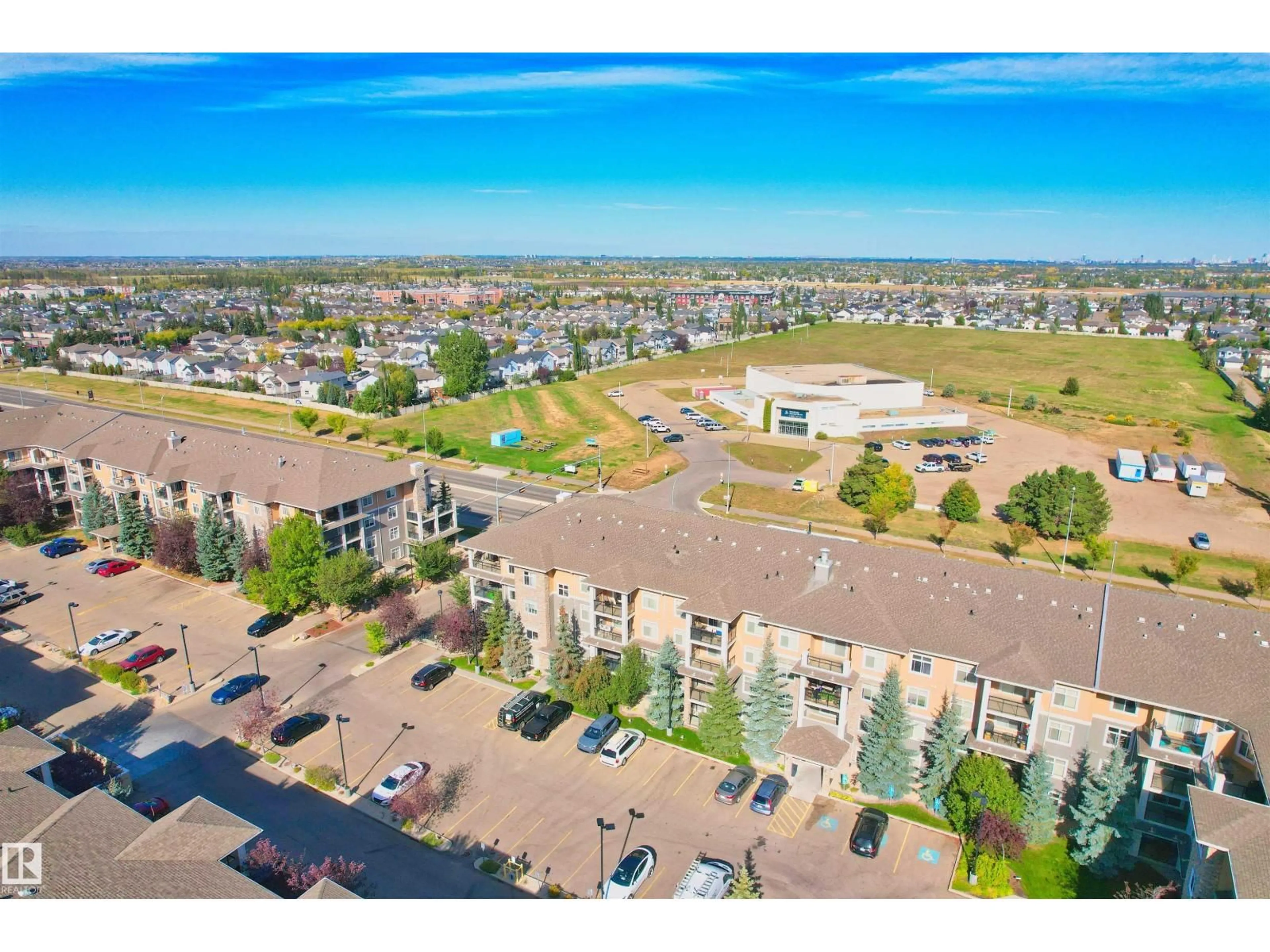 A pic from outside/outdoor area/front of a property/back of a property/a pic from drone, mountain view for 250 ELLERSLIE RD, Edmonton Alberta T6W2A9