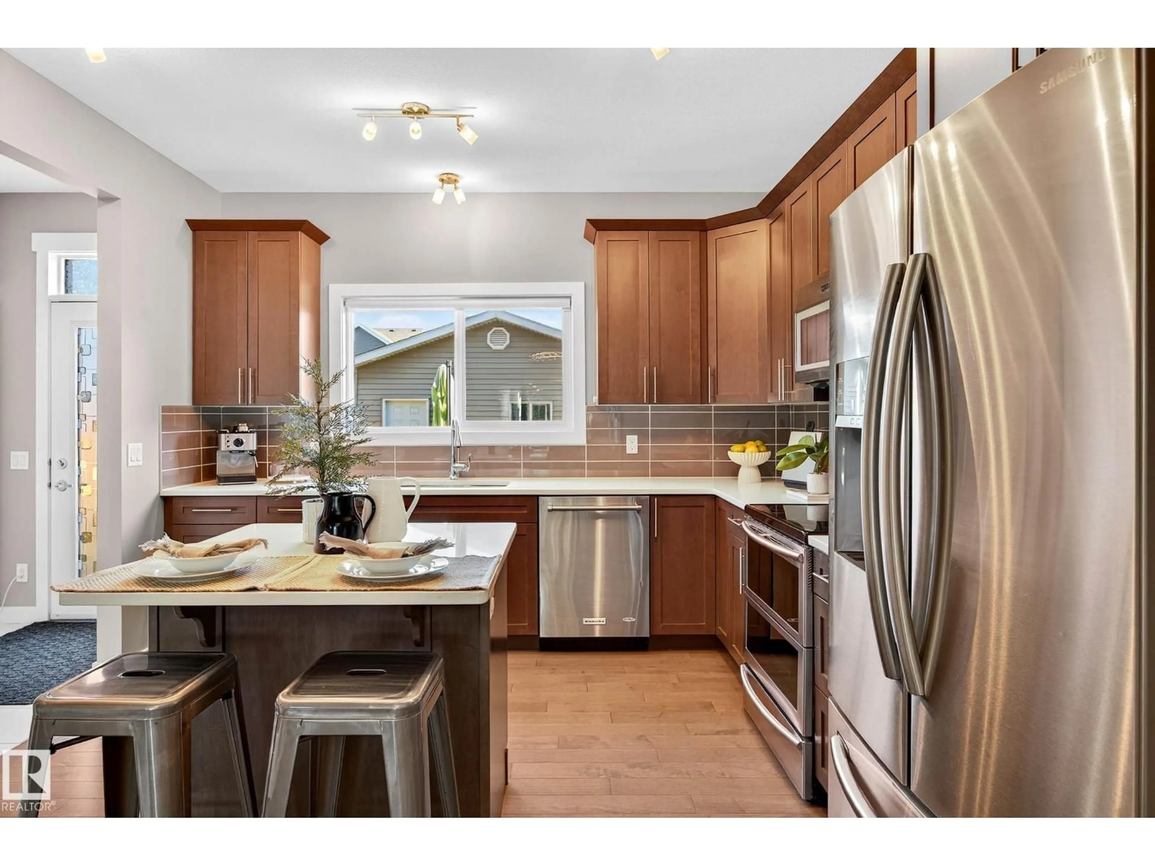 Open concept kitchen, wood/laminate floor for SW - 2335 70 ST, Edmonton Alberta T6X1Z2