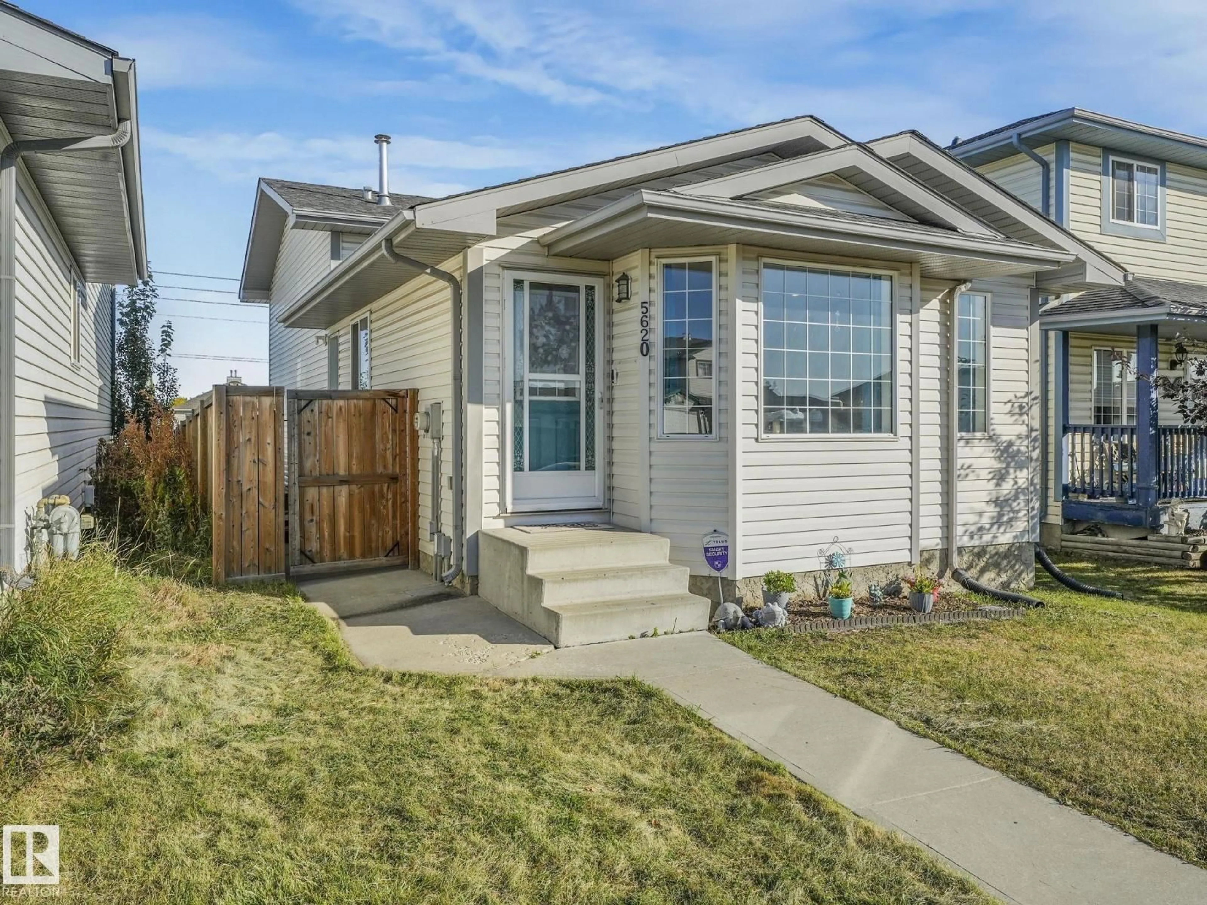 Home with vinyl exterior material, street for 5620 162A AV, Edmonton Alberta T5Y2V8