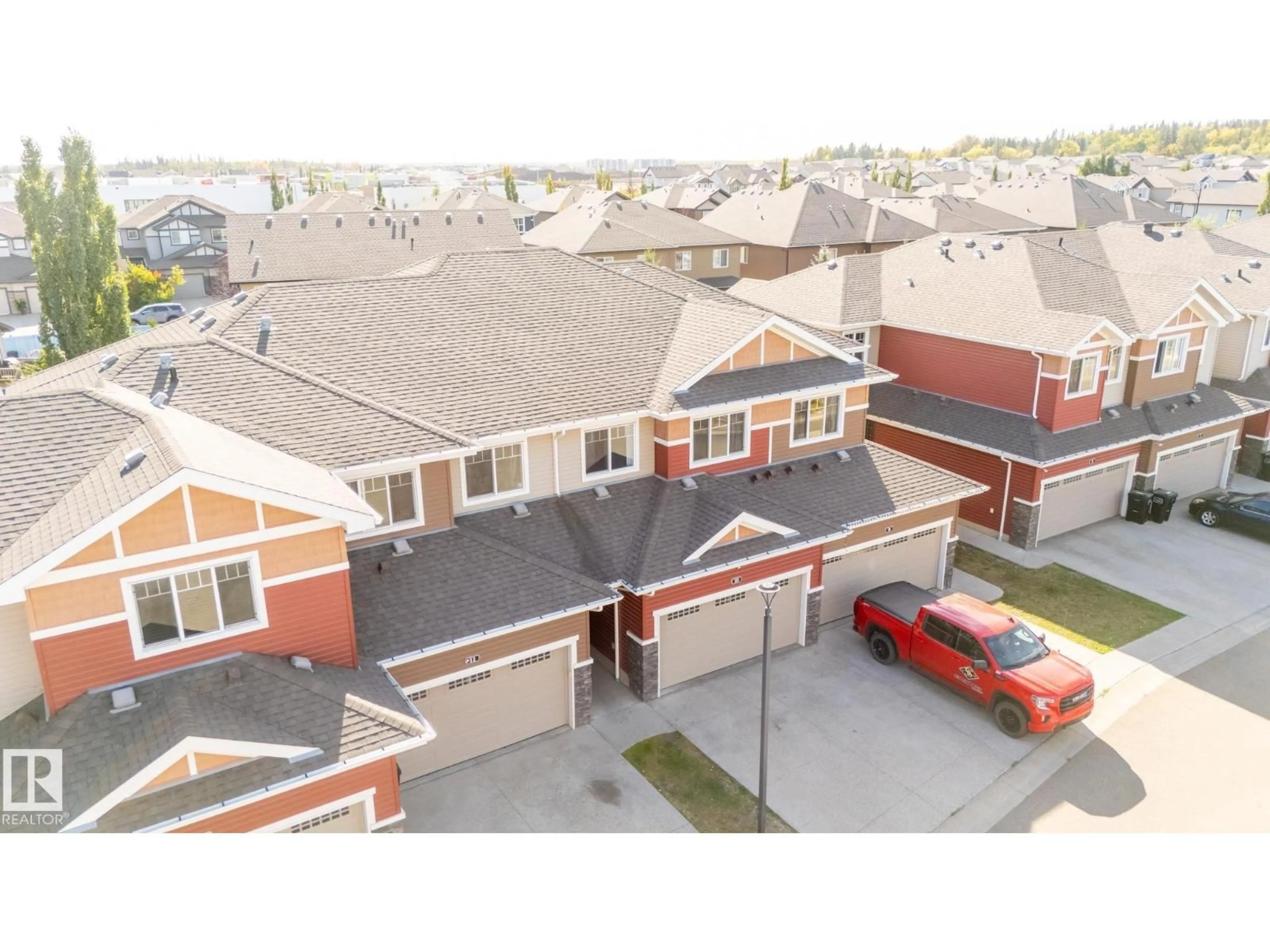 A pic from outside/outdoor area/front of a property/back of a property/a pic from drone, street for 10 - 3103 HILTON DR, Edmonton Alberta T6M0R3
