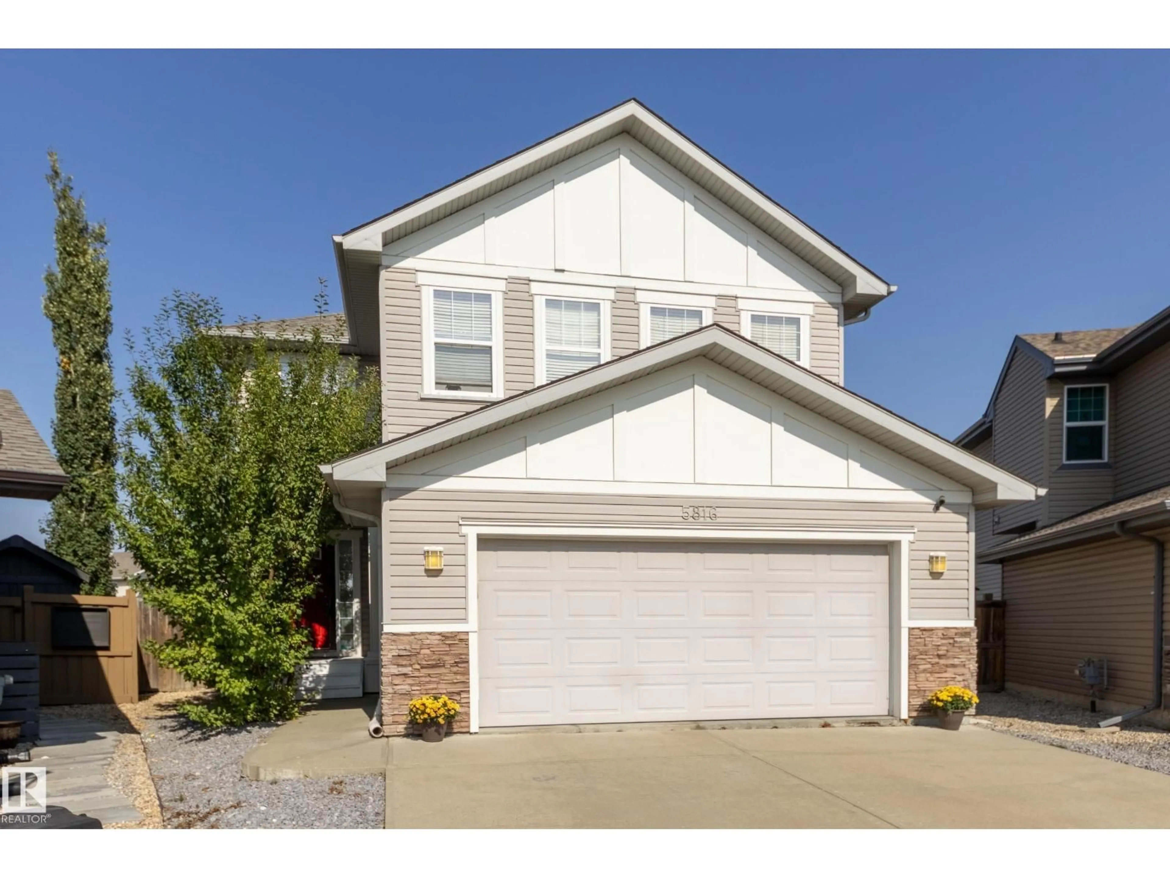 Home with vinyl exterior material, street for 5816 168 AV, Edmonton Alberta T5Y0K6