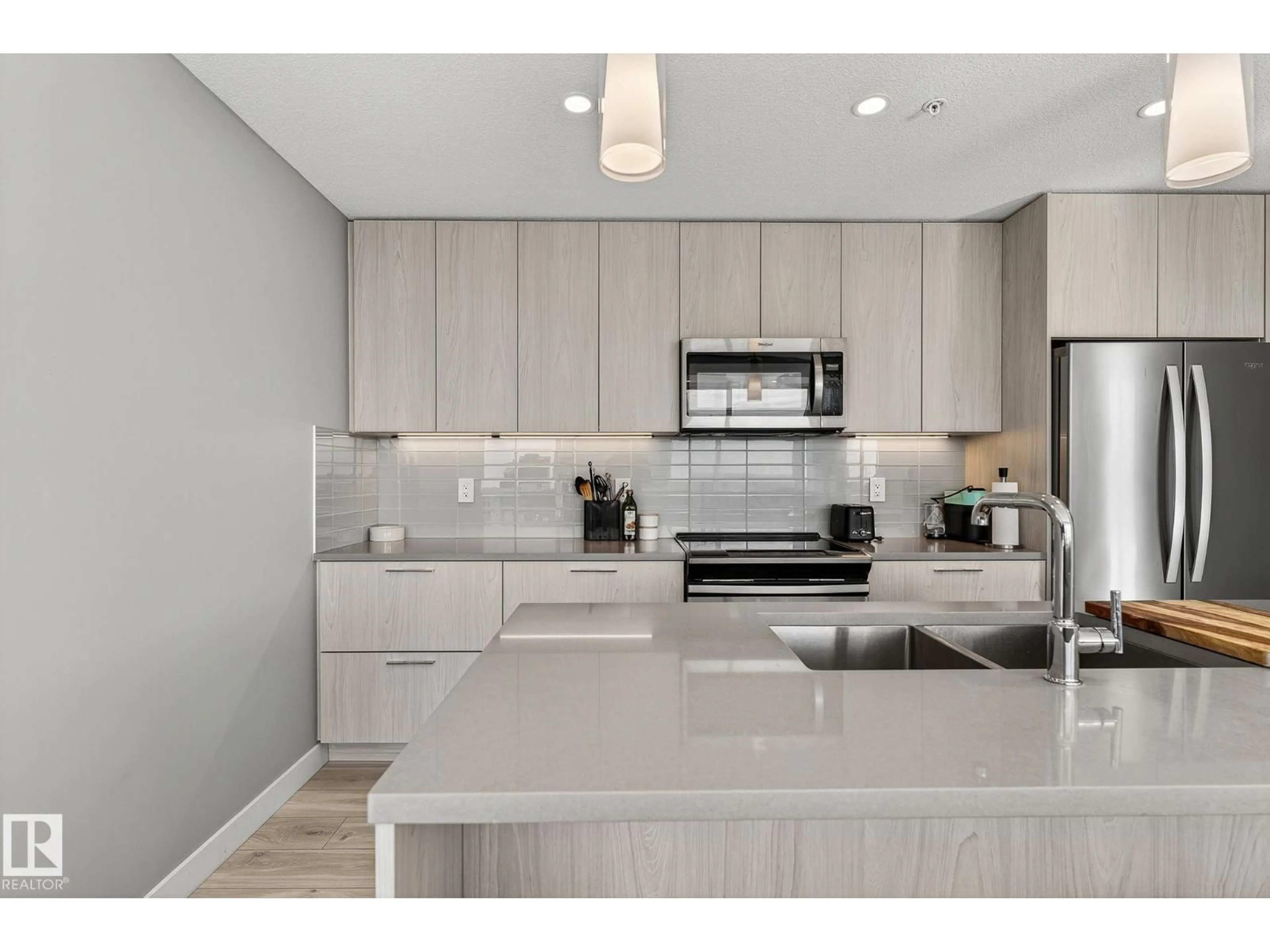 Open concept kitchen, ceramic/tile floor for 3100 10180 103 ST NW, Edmonton Alberta T5J0L1
