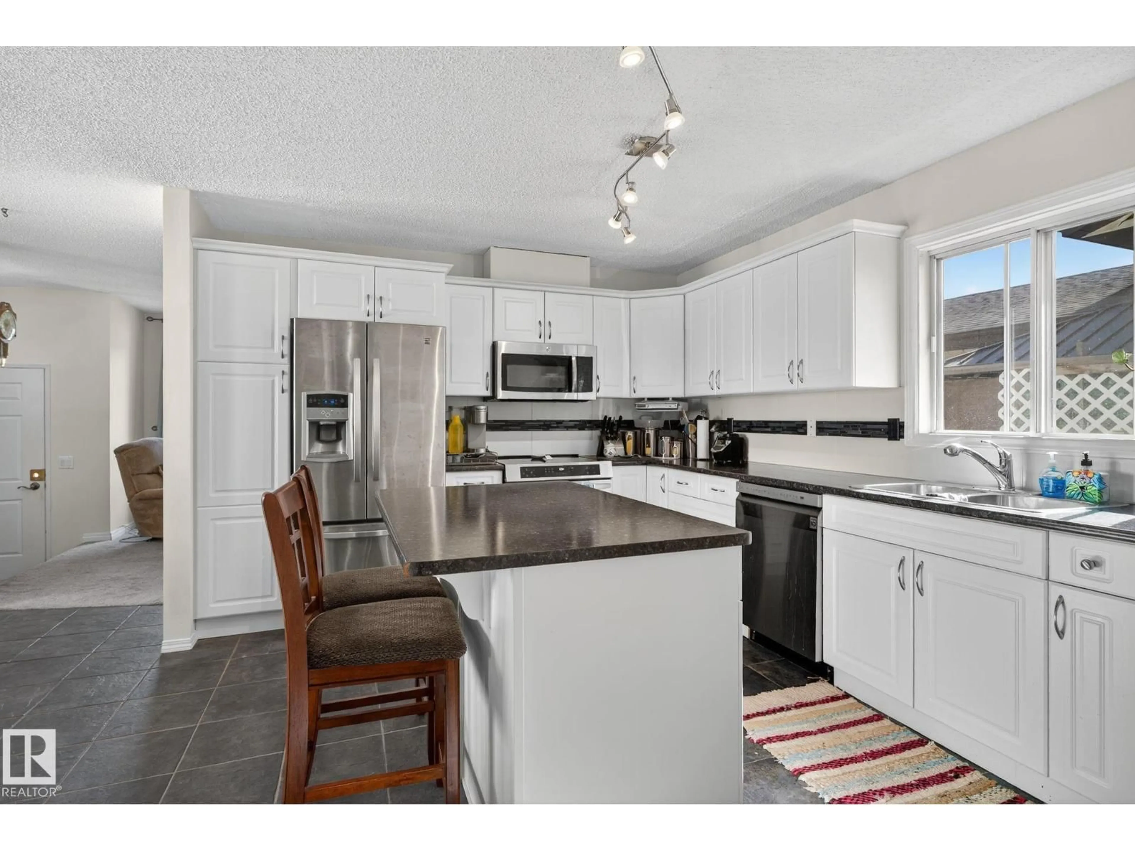Open concept kitchen, ceramic/tile floor for 5604 186 ST, Edmonton Alberta T6M1Z9