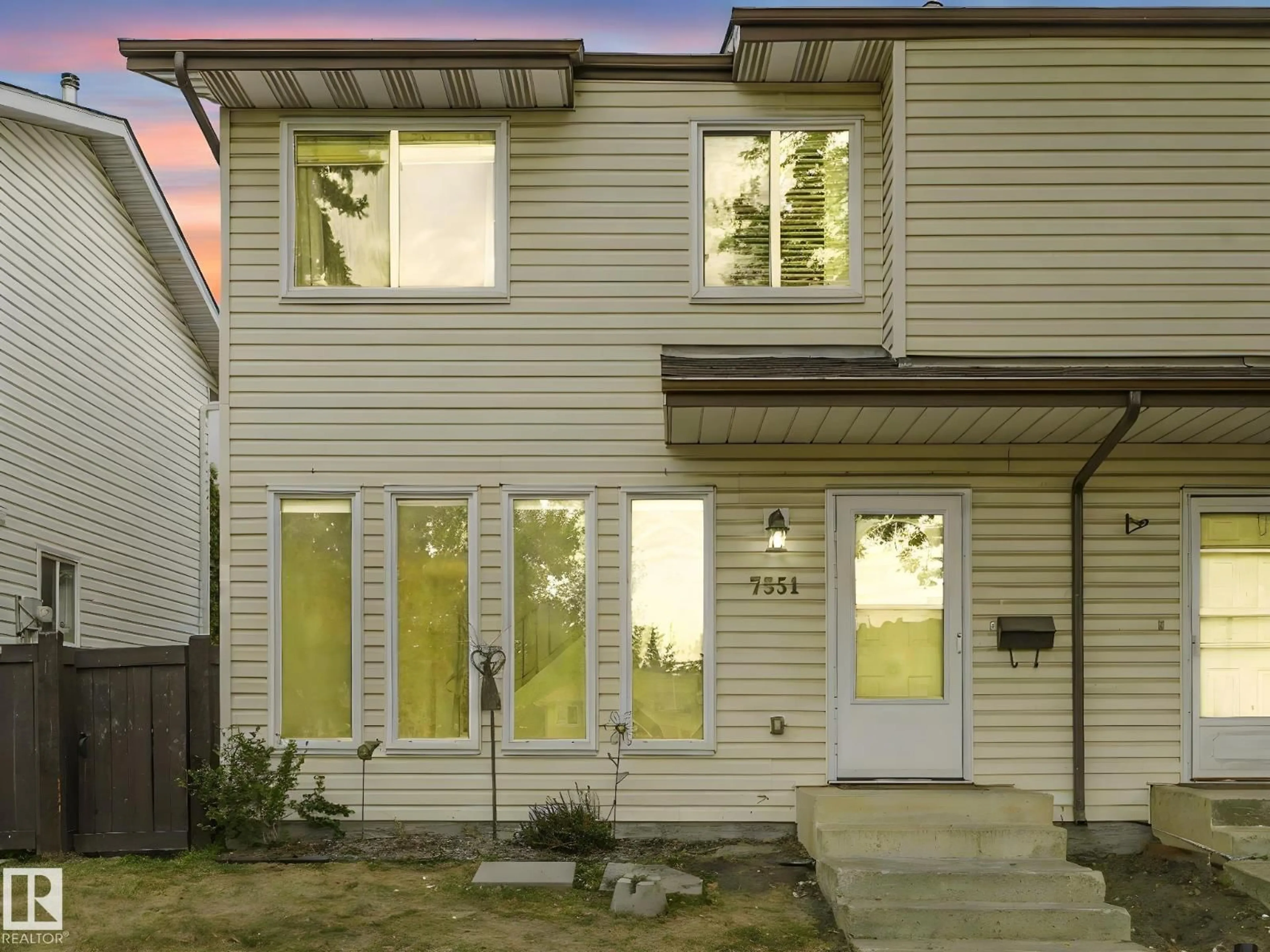 Home with vinyl exterior material, street for 7351 180 ST, Edmonton Alberta T5T2T1