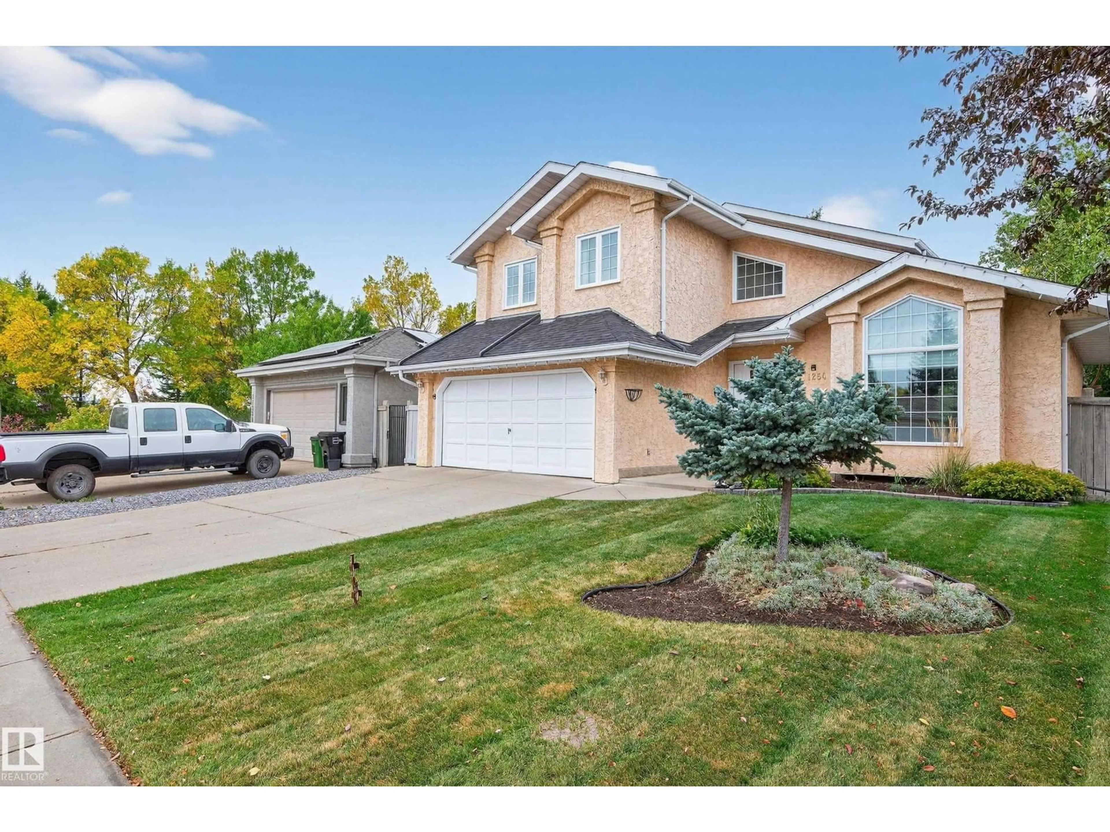 Home with vinyl exterior material, street for 11254 10A AV, Edmonton Alberta T6J6S3