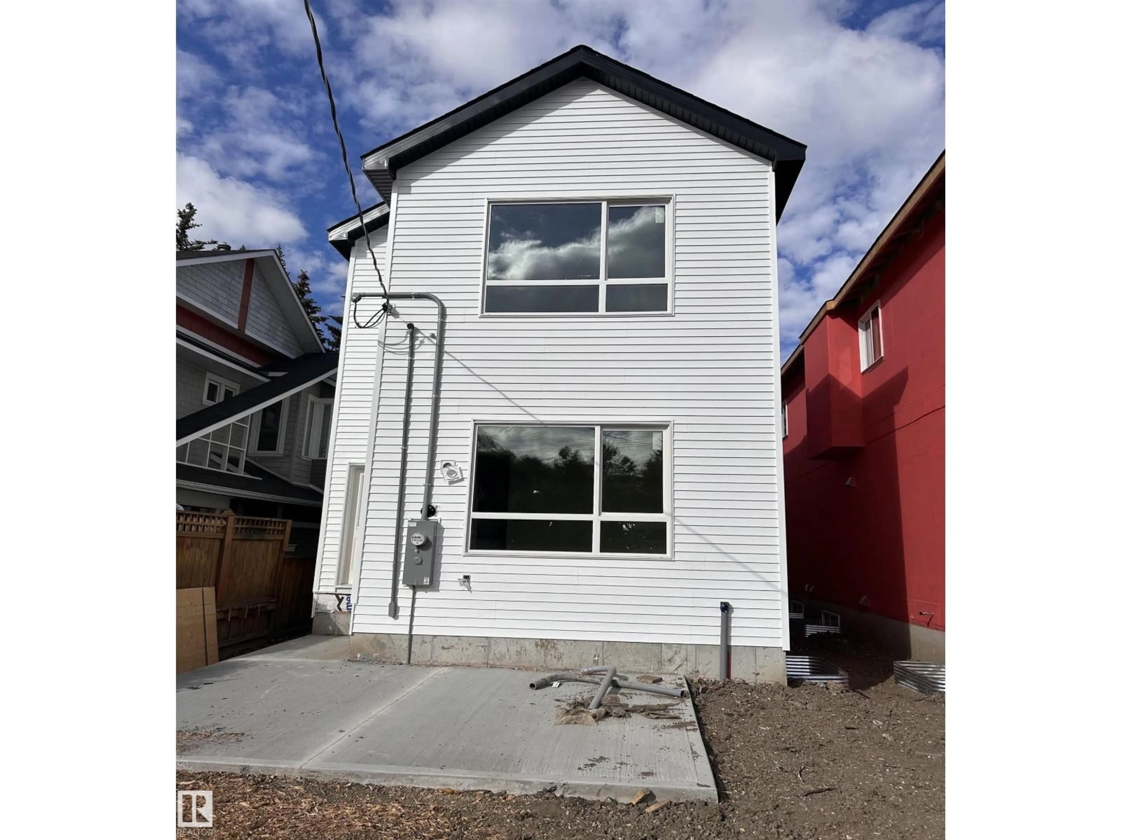 Home with vinyl exterior material, street for 11613 79 AV, Edmonton Alberta T5X6C5