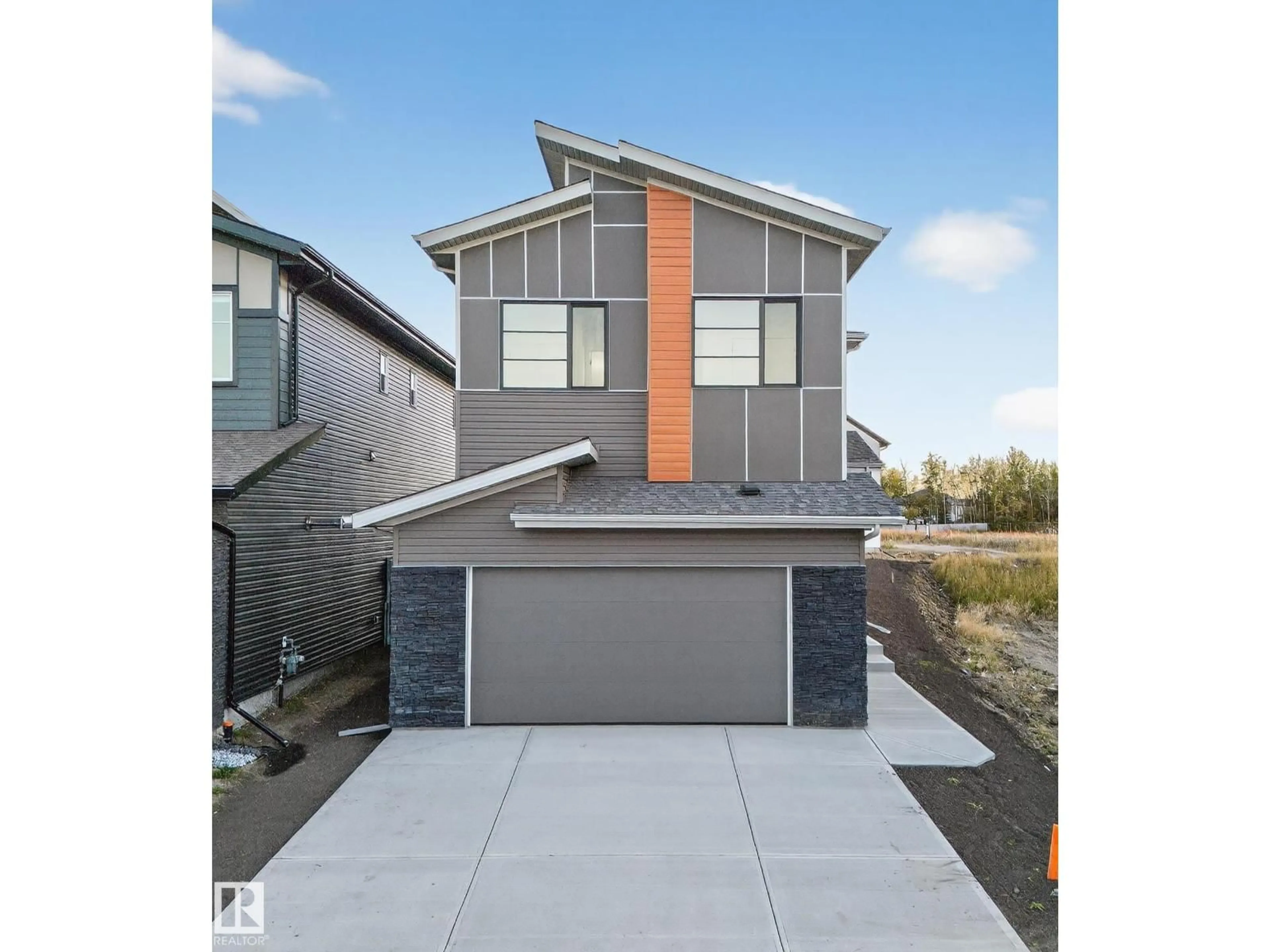 Home with vinyl exterior material, street for NE - 715 166 AV, Edmonton Alberta T5Y2Z6