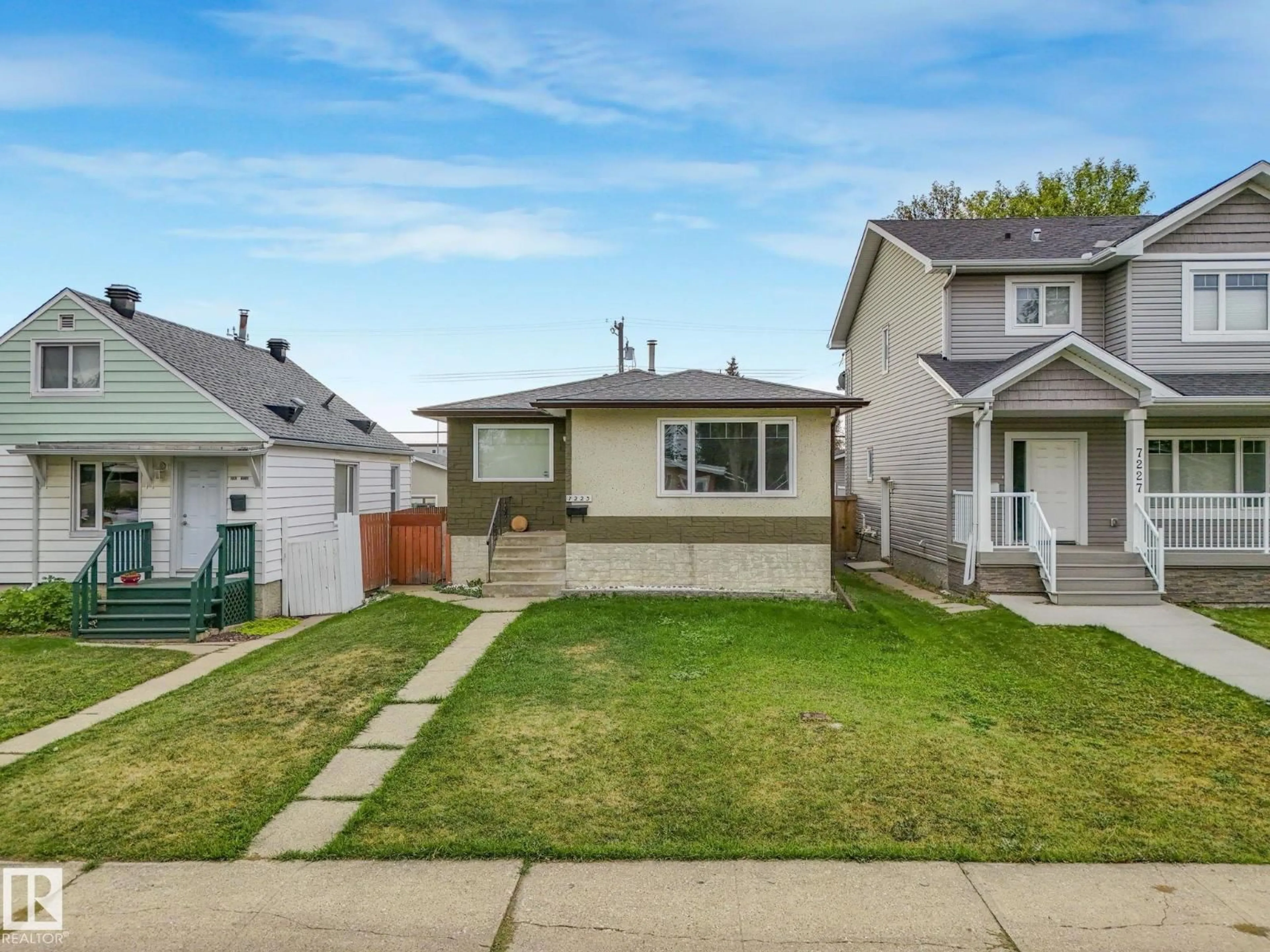 Home with vinyl exterior material, street for 7223 83 AV, Edmonton Alberta T6B0G7