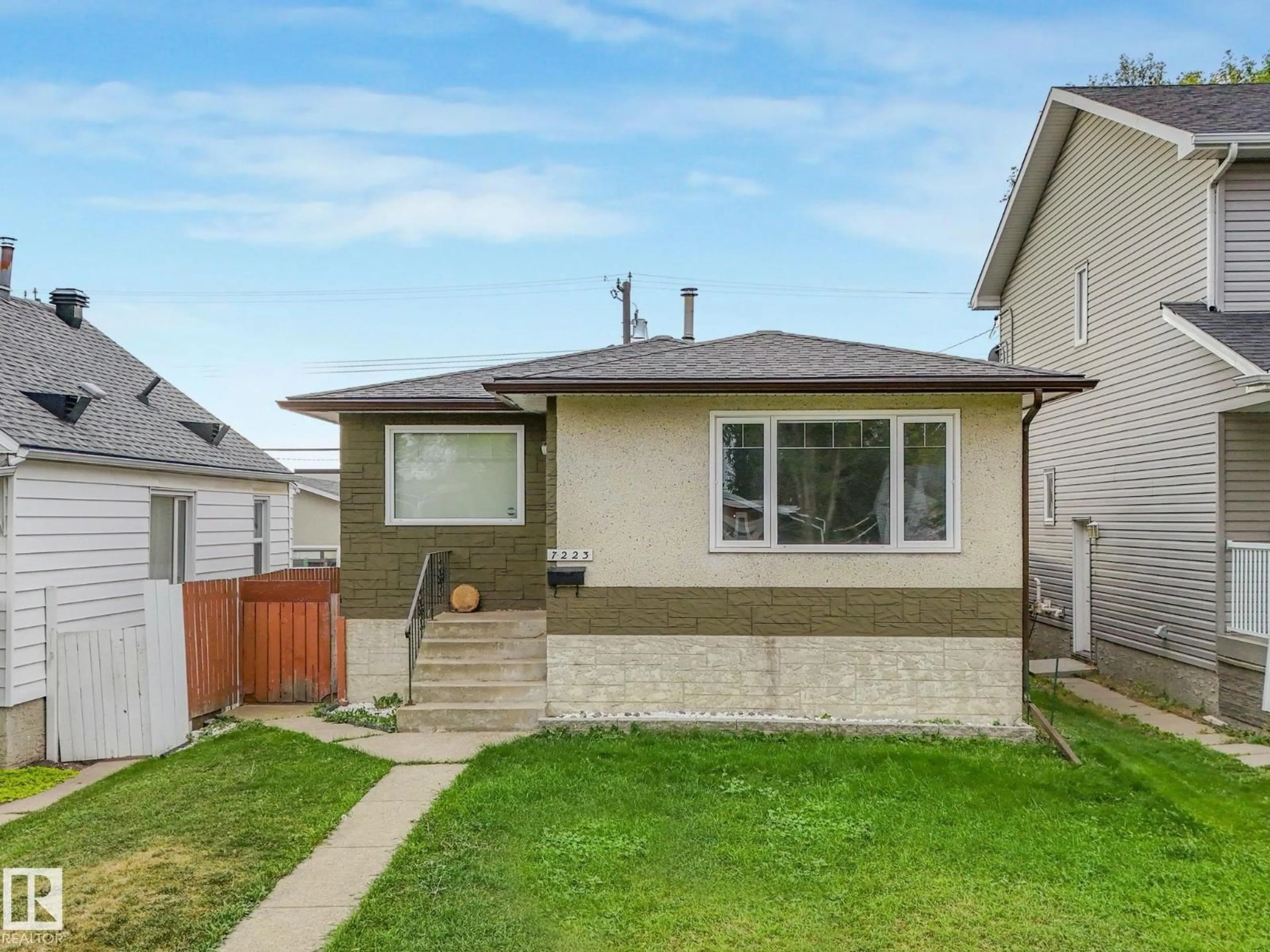 Home with vinyl exterior material, street for 7223 83 AV, Edmonton Alberta T6B0G7