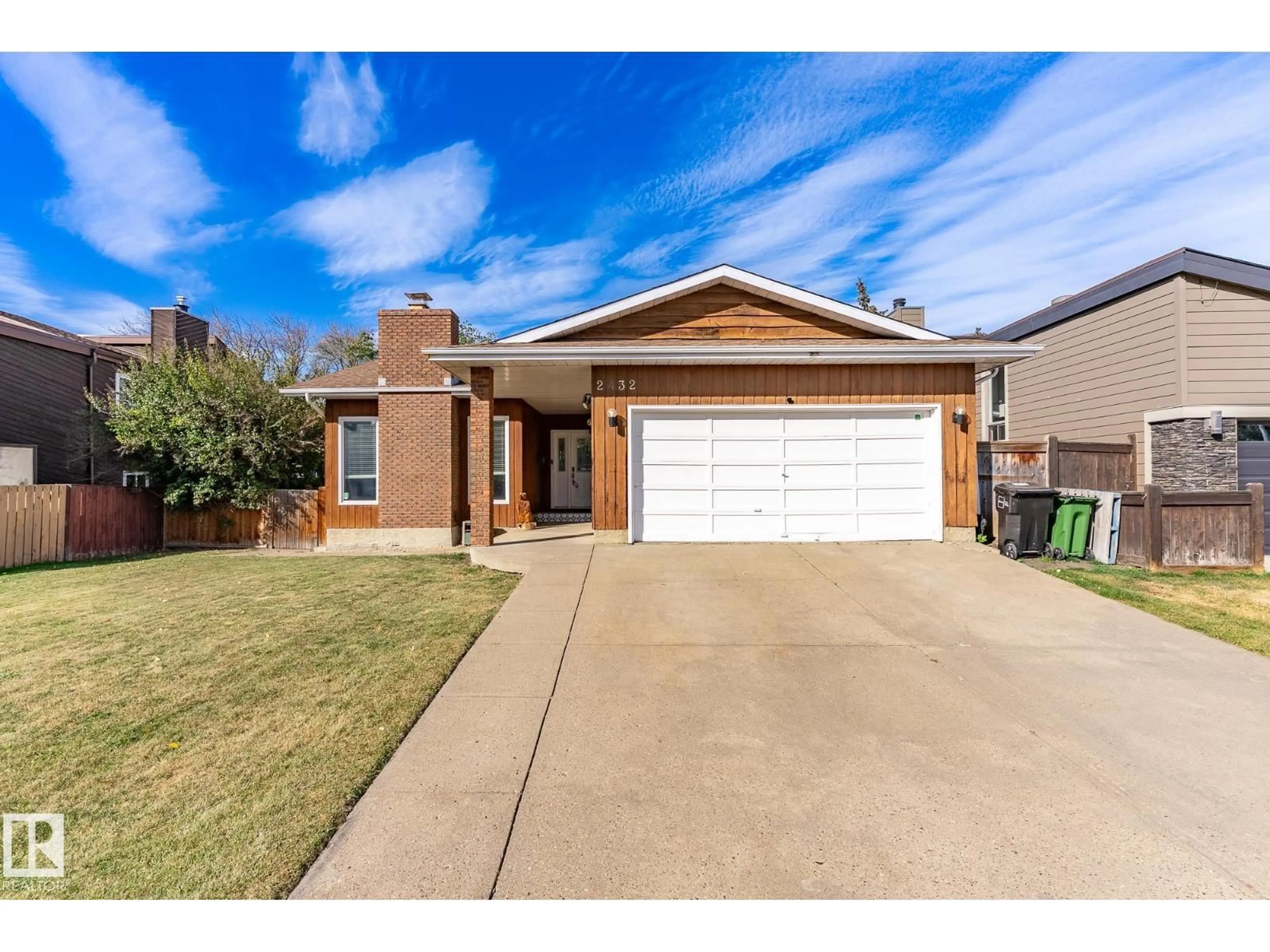 Home with brick exterior material, street for NW - 2432 106 ST, Edmonton Alberta T6J4K5