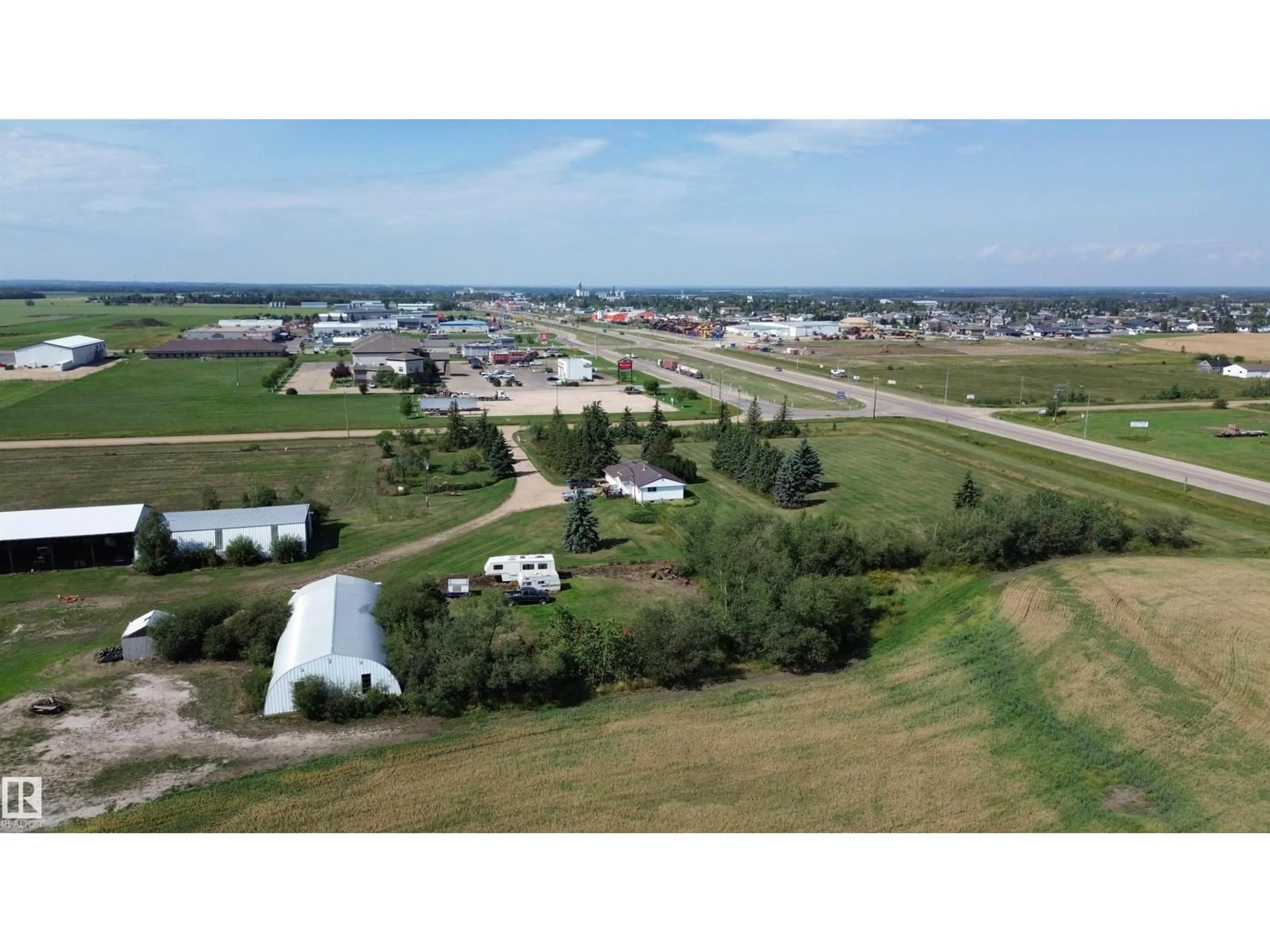 A pic from outside/outdoor area/front of a property/back of a property/a pic from drone, mountain view for 9839 115 AV, Rural Westlock County Alberta T7P1P5