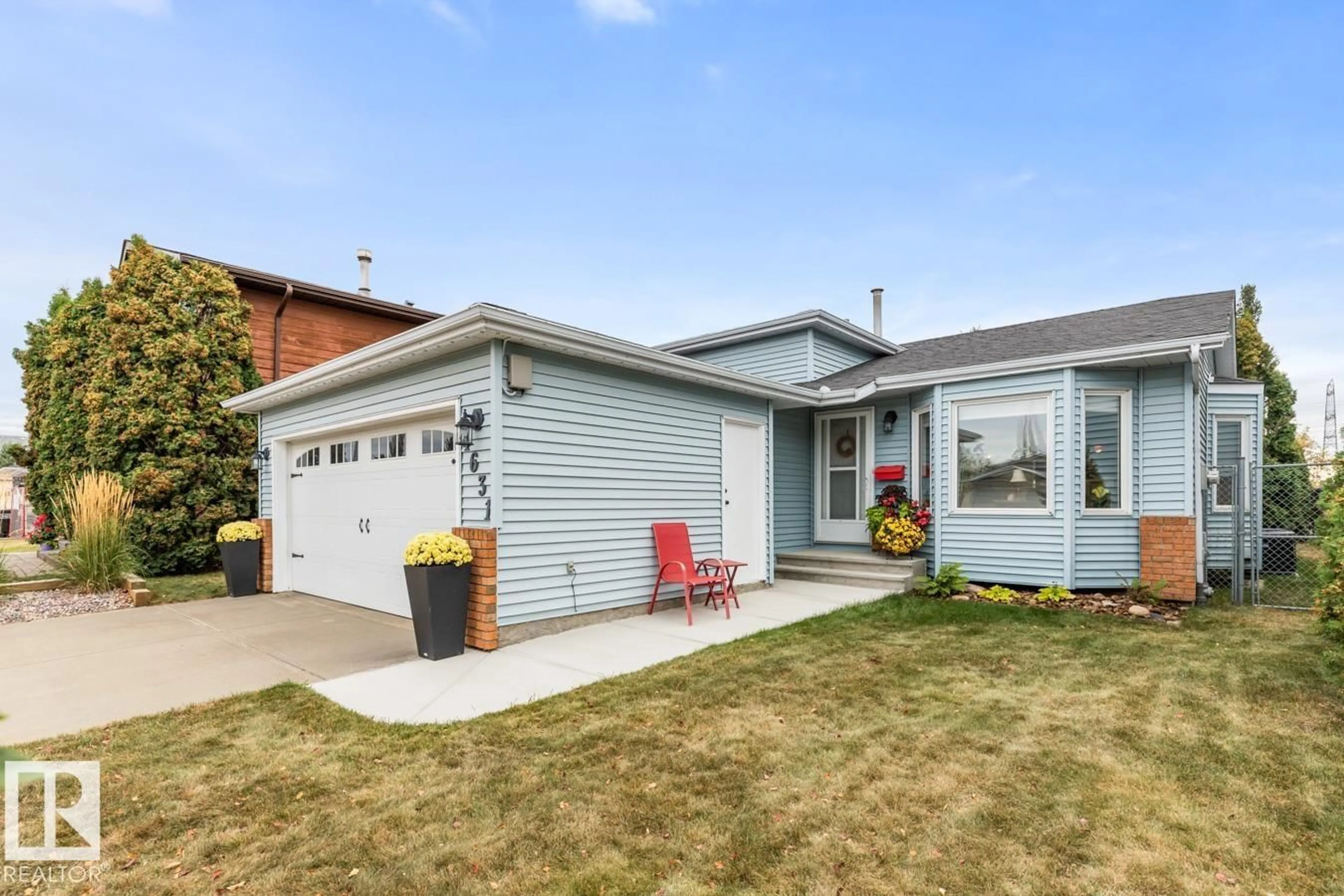 Home with vinyl exterior material, street for 4631 10 AV NW, Edmonton Alberta T6L4S2