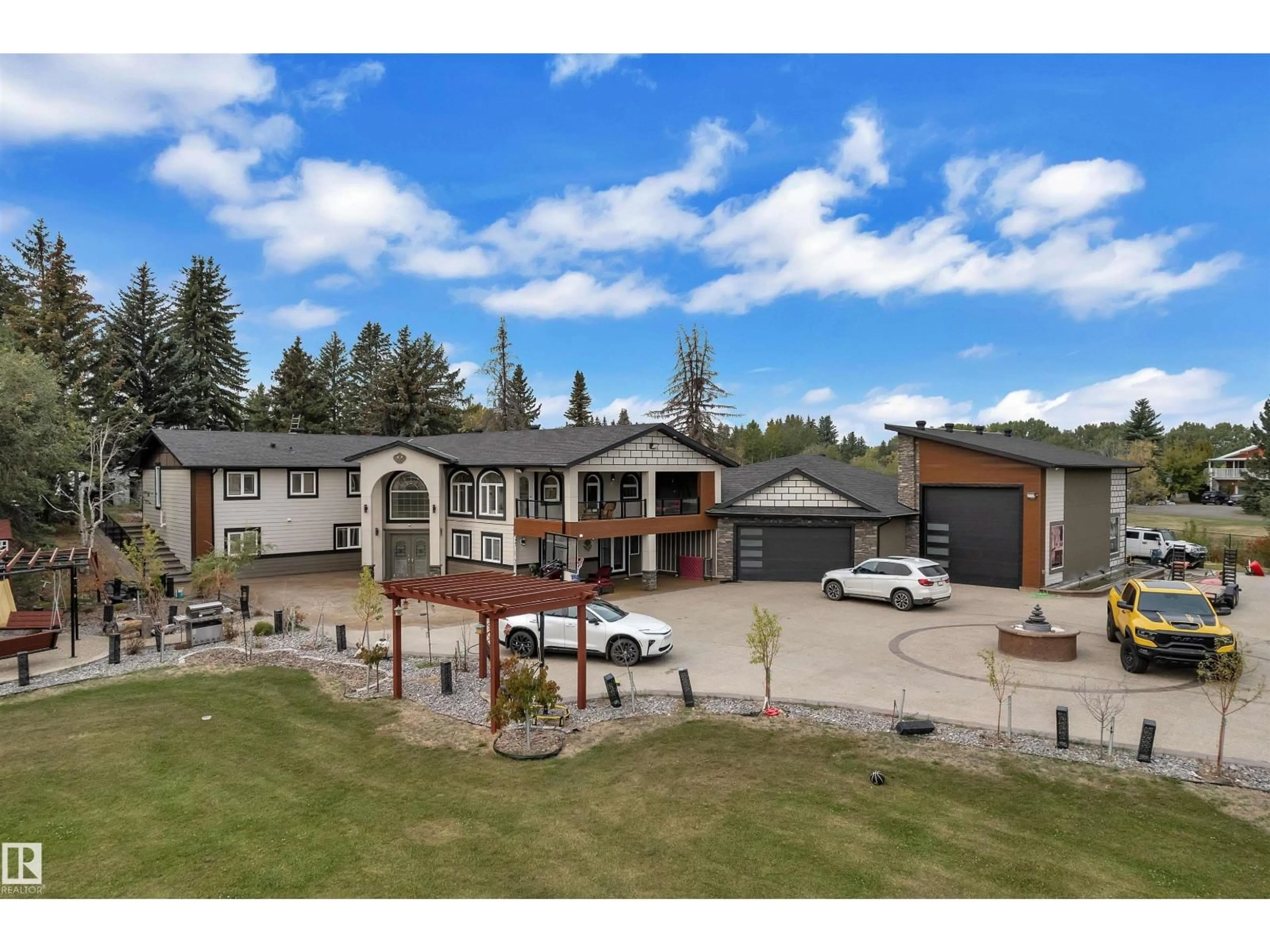 A pic from outside/outdoor area/front of a property/back of a property/a pic from drone, mountain view for 23020 - 230 TWP 522, Rural Strathcona County Alberta T8B1H8