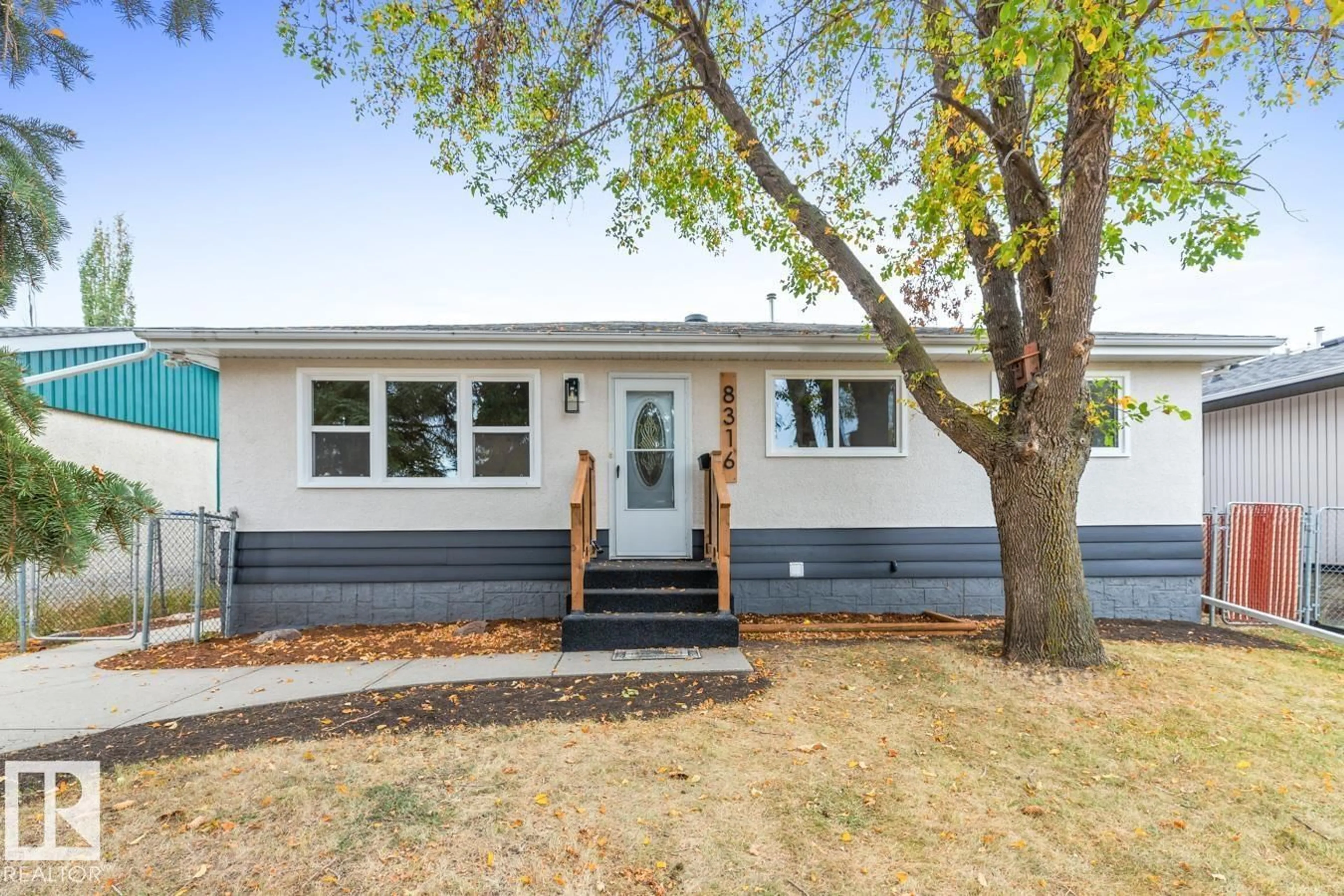 Home with vinyl exterior material, street for NW - 8316 68A ST, Edmonton Alberta T6B1T3