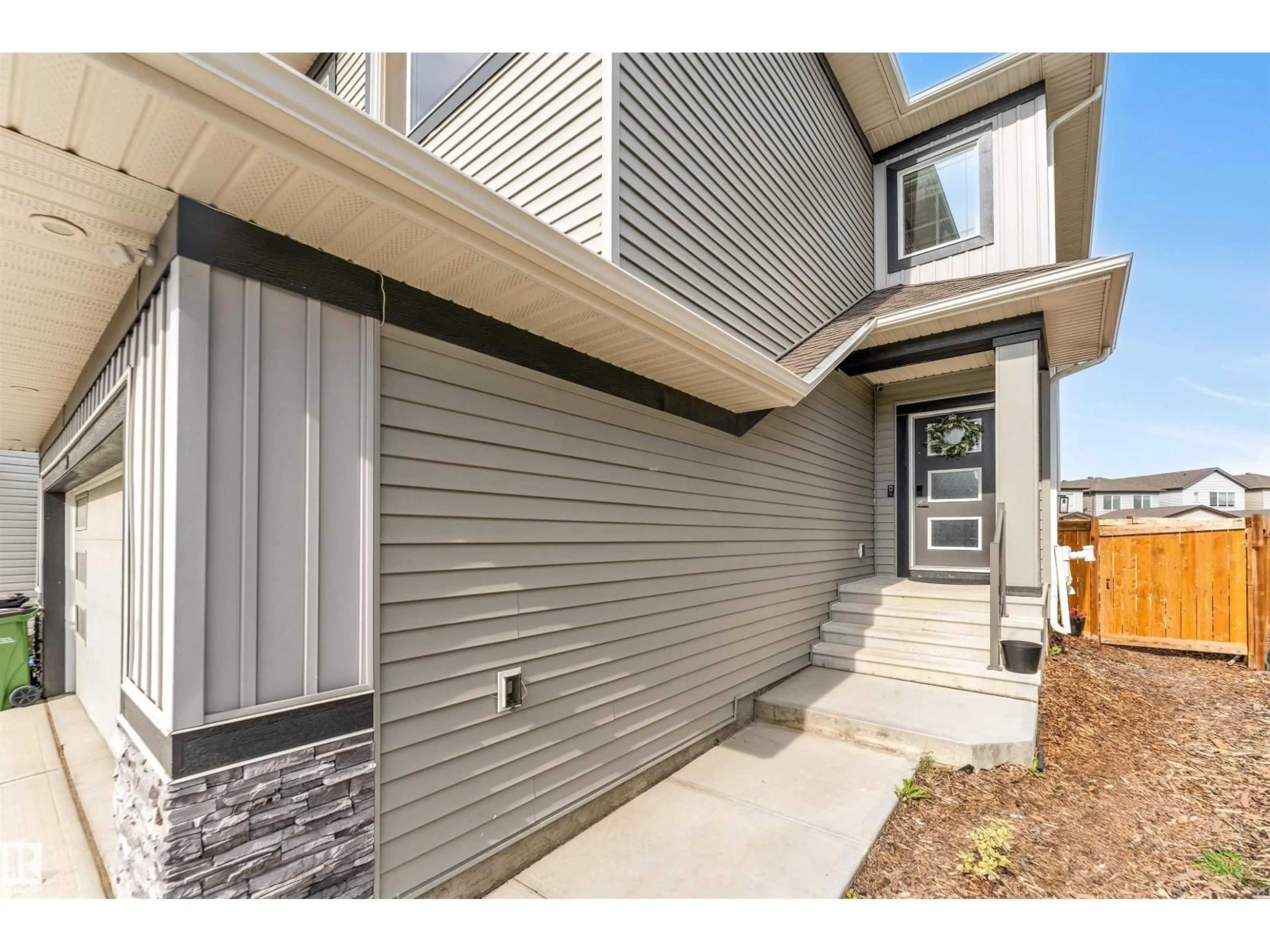 Home with vinyl exterior material, street for 2404 13 AV, Edmonton Alberta T6T0V1