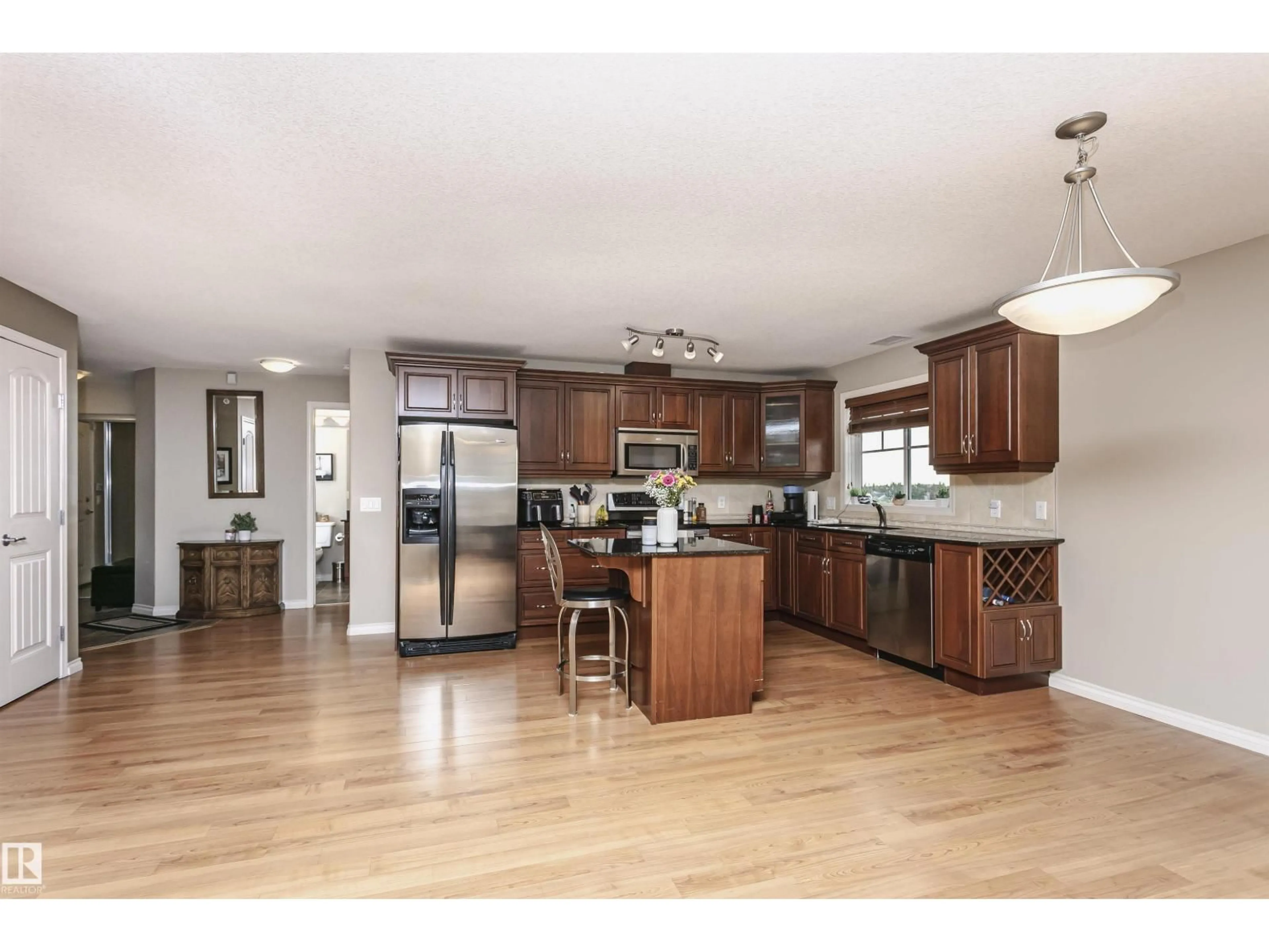 Open concept kitchen, wood/laminate floor for #433 - 2096 BLACKMUD CREEK DR, Edmonton Alberta T6W0G1