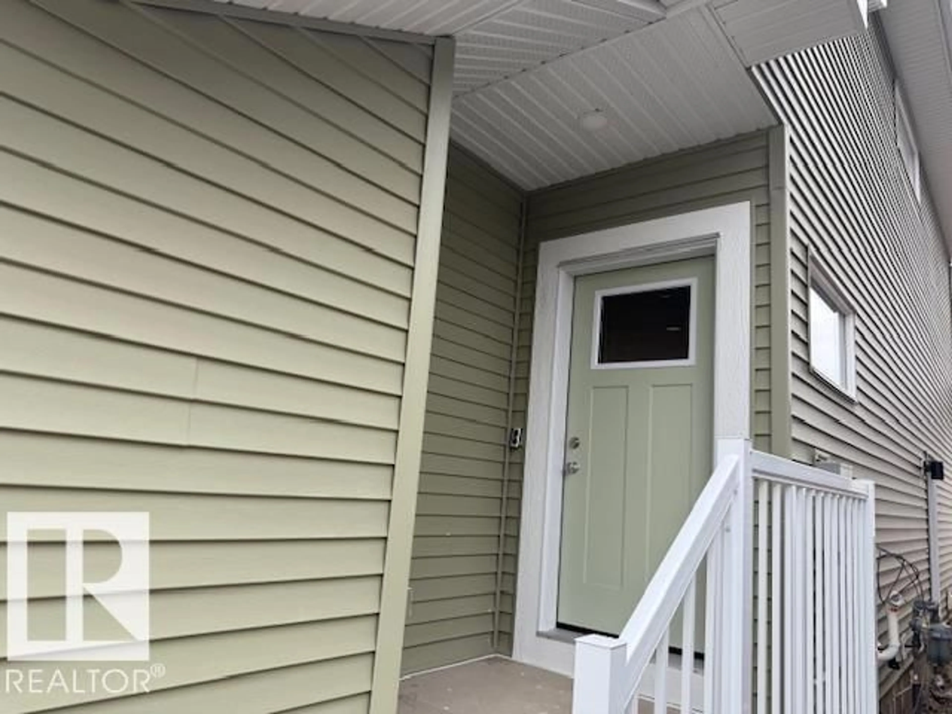 Home with vinyl exterior material, street for 18111 74 ST, Edmonton Alberta T5Z0X7