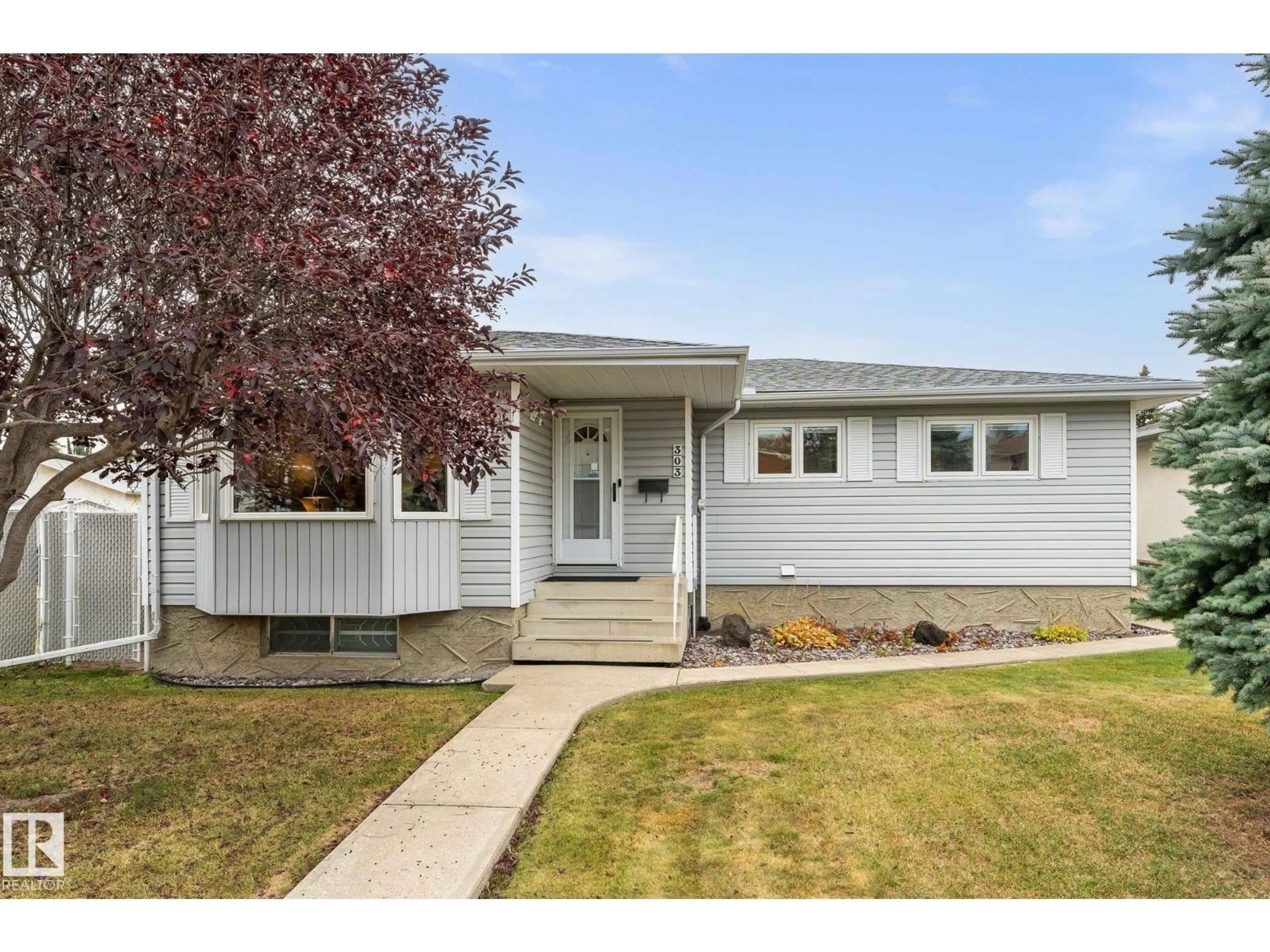 Home with vinyl exterior material, street for 303 KNOTTWOOD RD RD, Edmonton Alberta T6K2G5