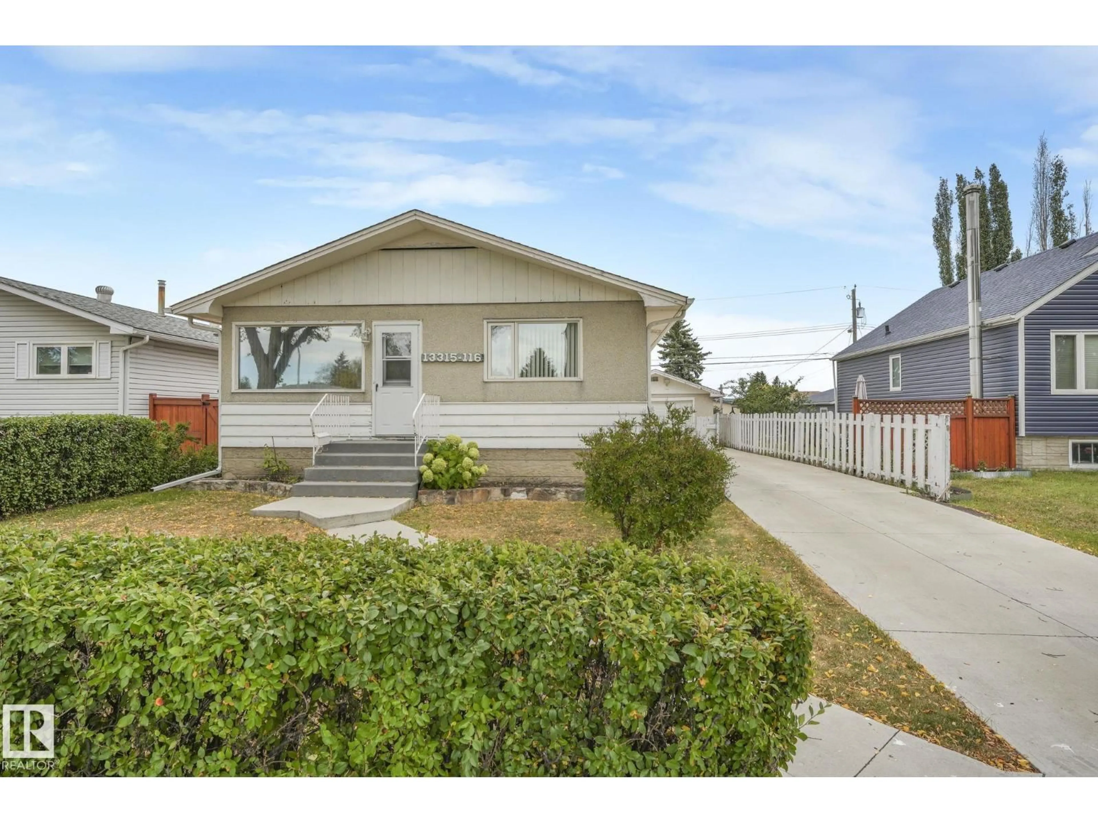 Home with vinyl exterior material, street for NW - 13315 116 ST, Edmonton Alberta T5E5H8