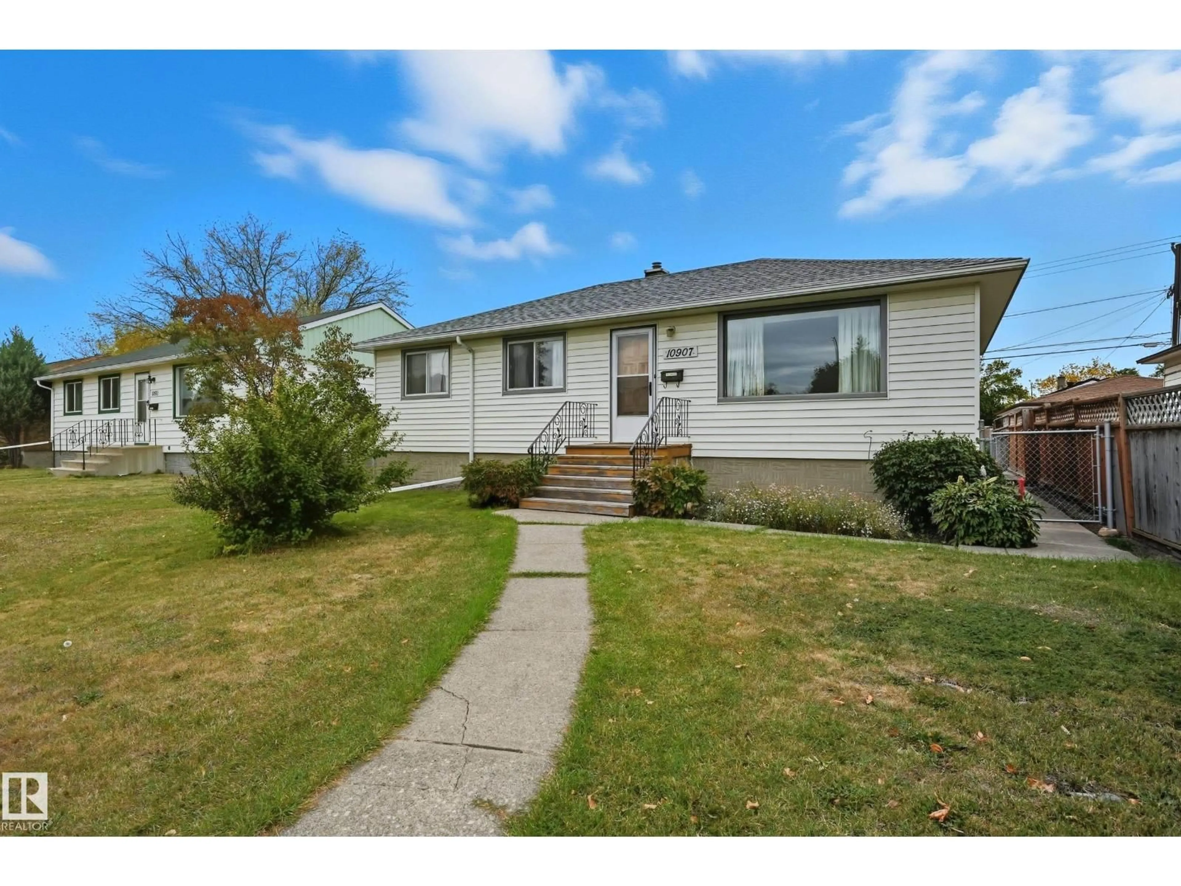 Home with vinyl exterior material, street for 10907 149 ST, Edmonton Alberta T5P1M7