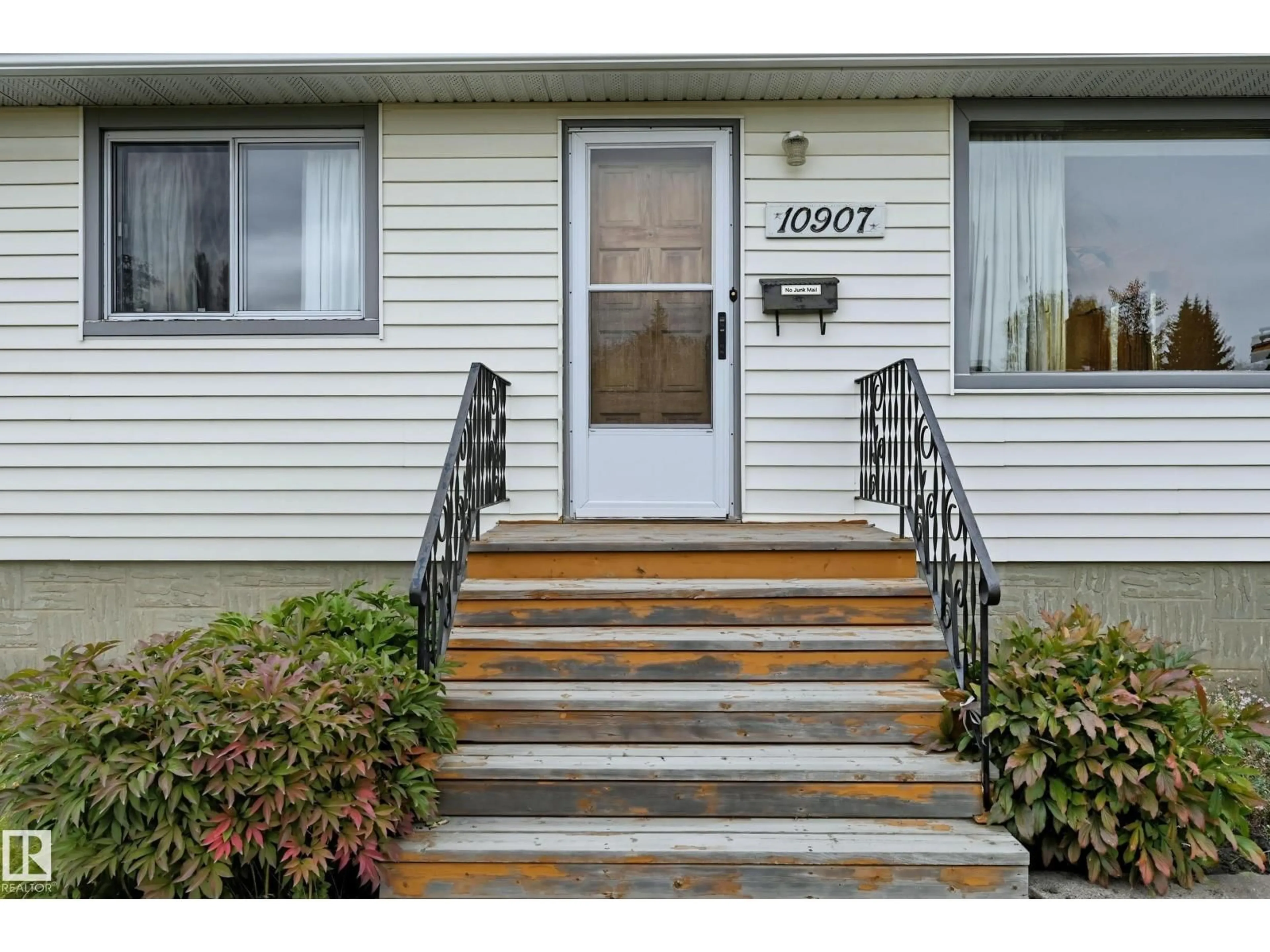 Home with vinyl exterior material, street for 10907 149 ST, Edmonton Alberta T5P1M7