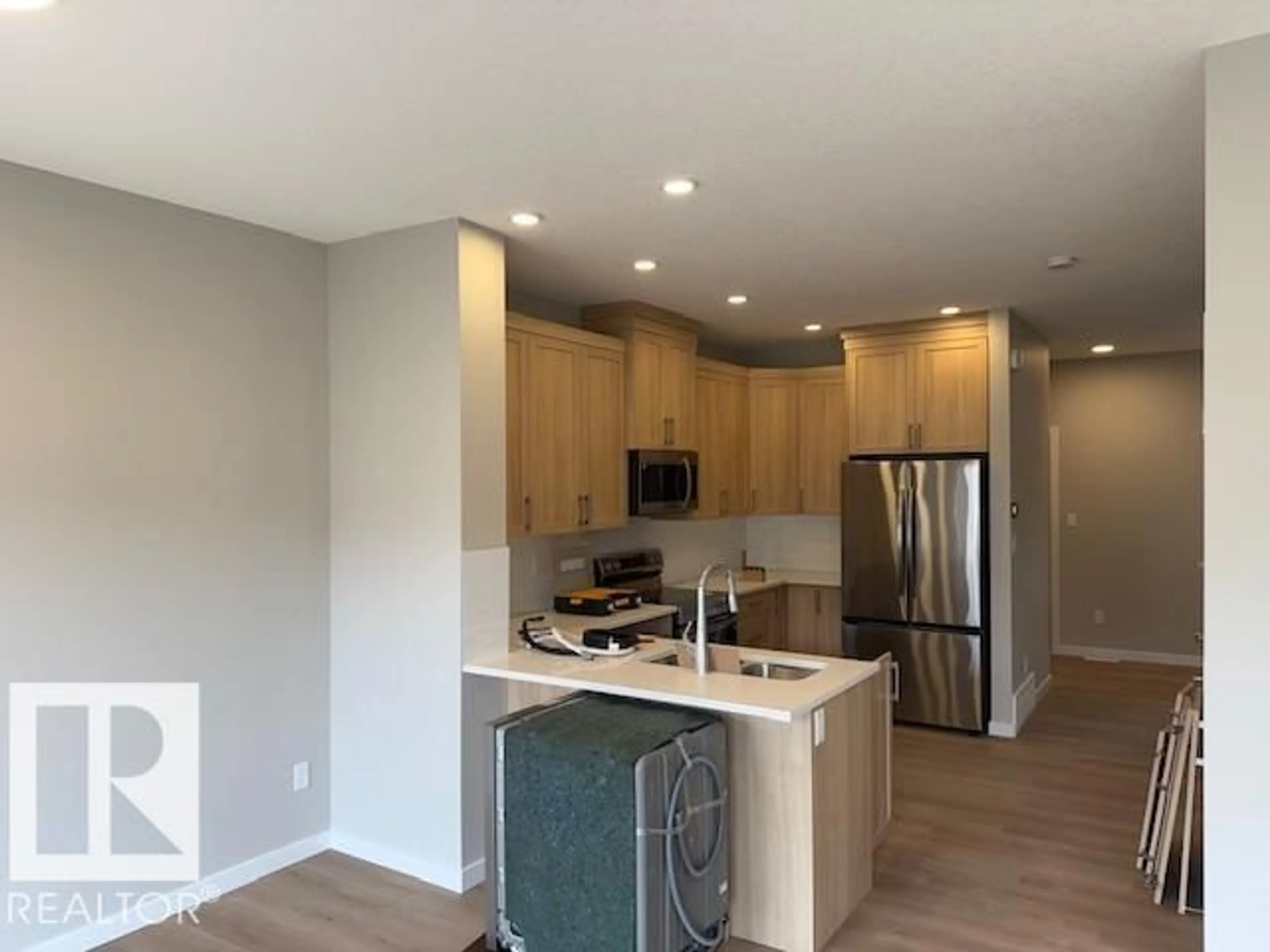 Open concept kitchen, wood/laminate floor for NW - 18113 74 ST, Edmonton Alberta T5Z0X7