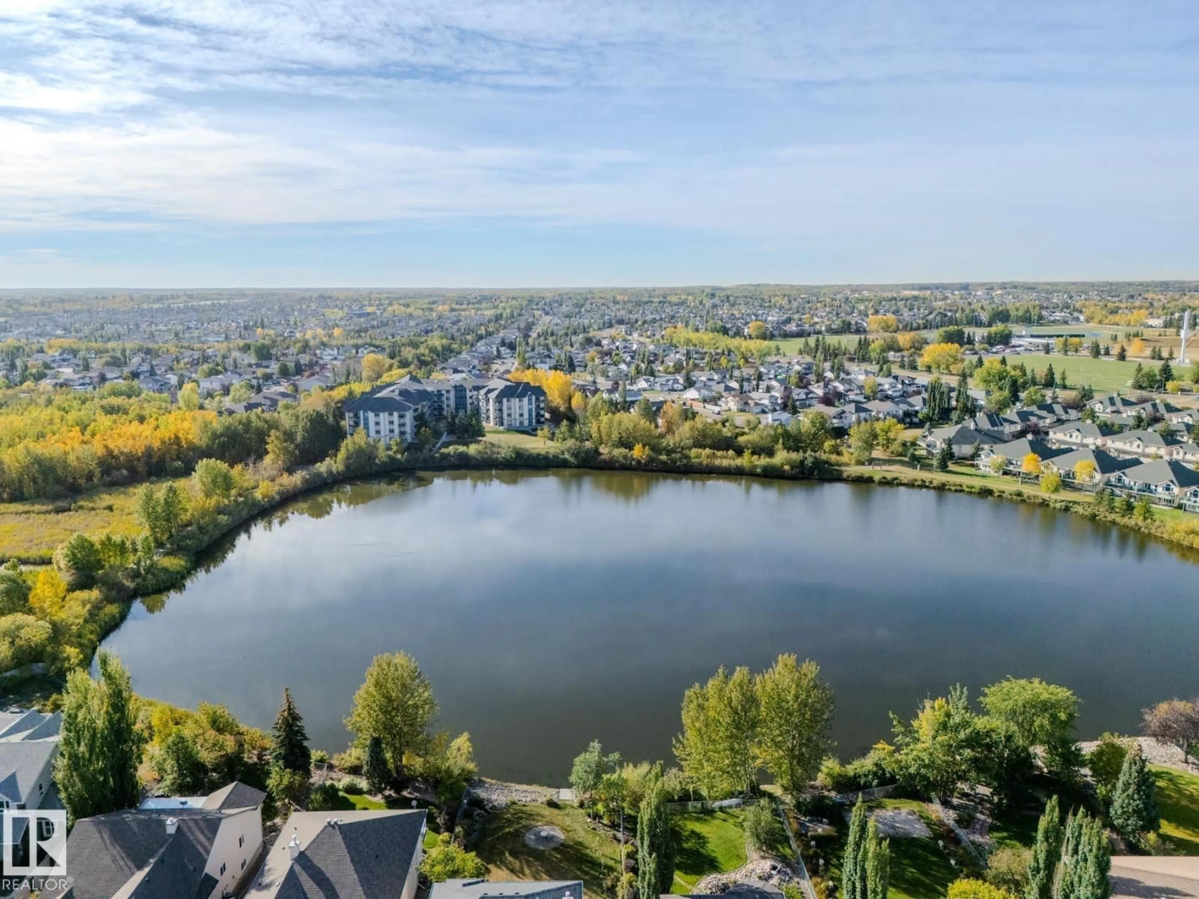 A pic from outside/outdoor area/front of a property/back of a property/a pic from drone, water/lake/river/ocean view for 13 HERITAGE LAKE WY, Sherwood Park Alberta T8A6A7