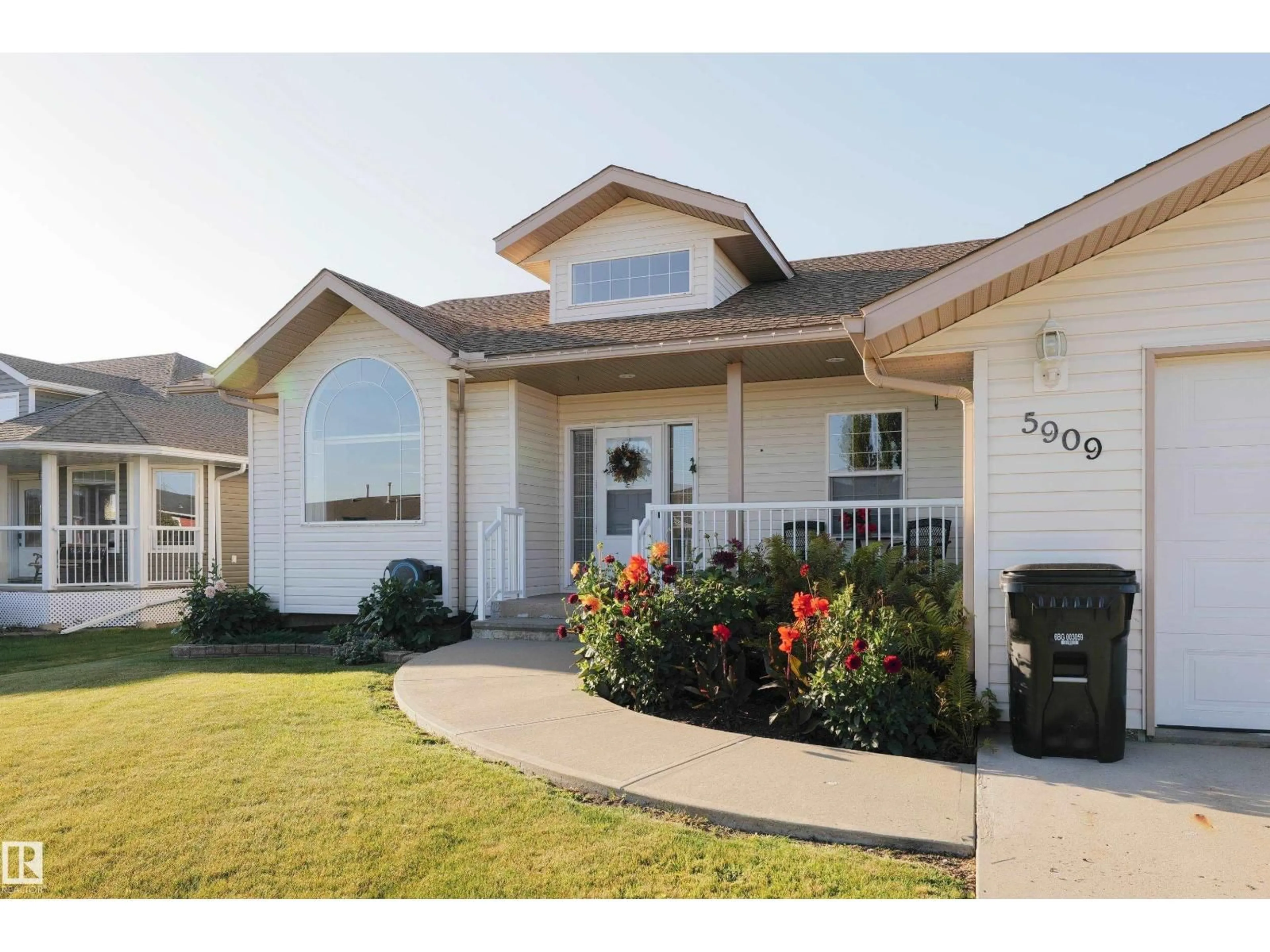 Home with vinyl exterior material, street for 5909 51 AV, Barrhead Alberta T7N1N7