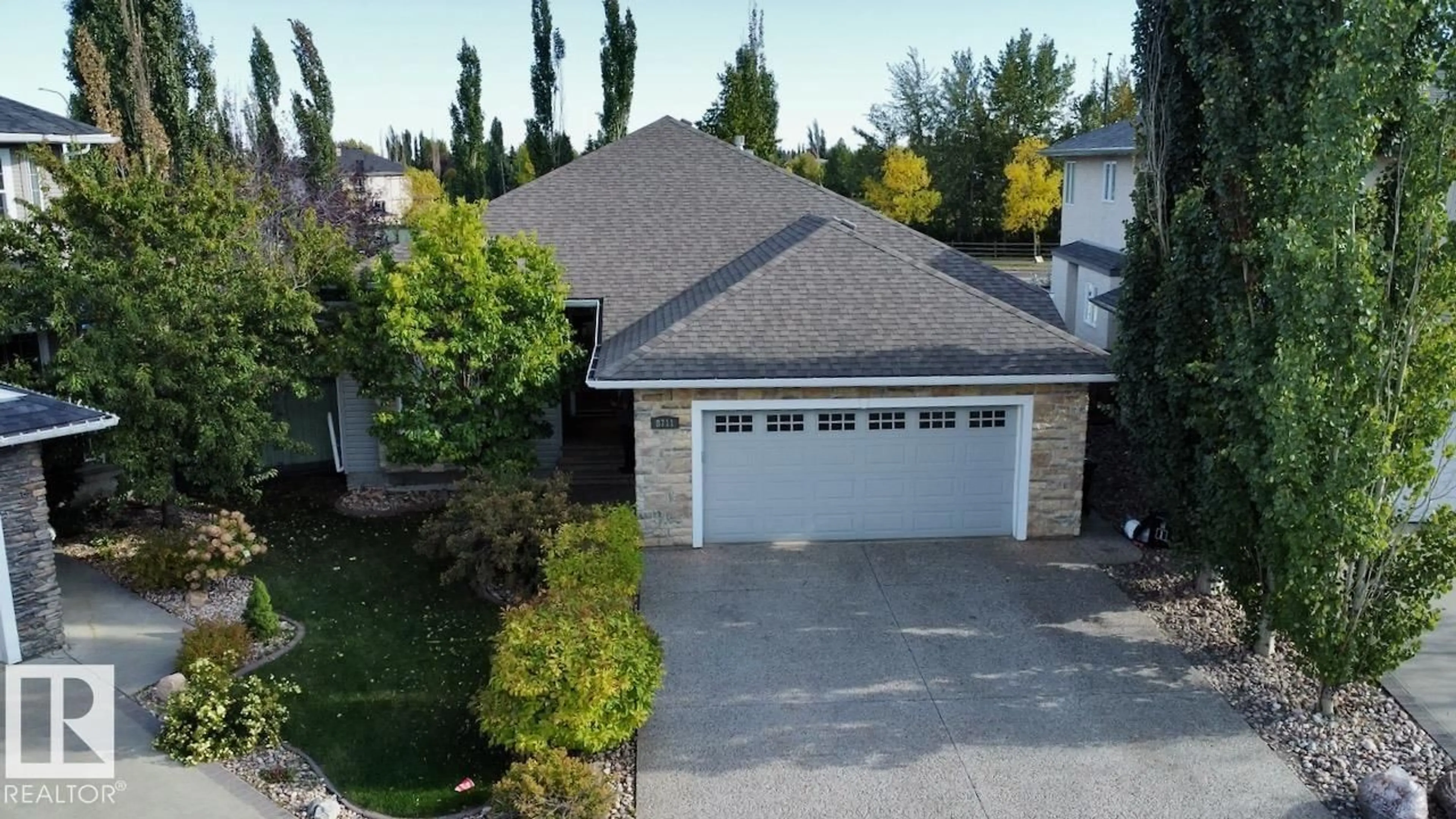 A pic from outside/outdoor area/front of a property/back of a property/a pic from drone, street for 8711 208 ST, Edmonton Alberta T5T6Y2