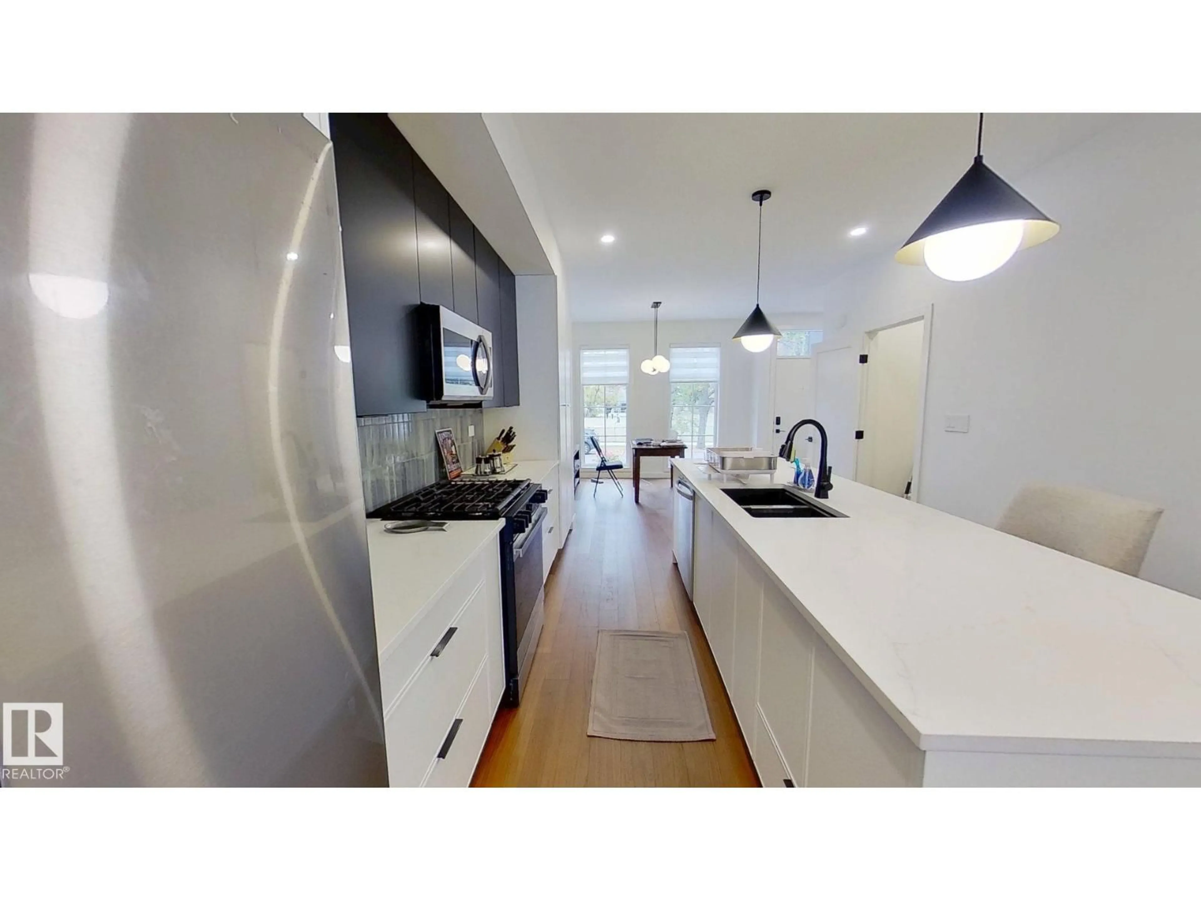 Open concept kitchen, unknown for 11308 128 ST NW, Edmonton Alberta T5M0W9