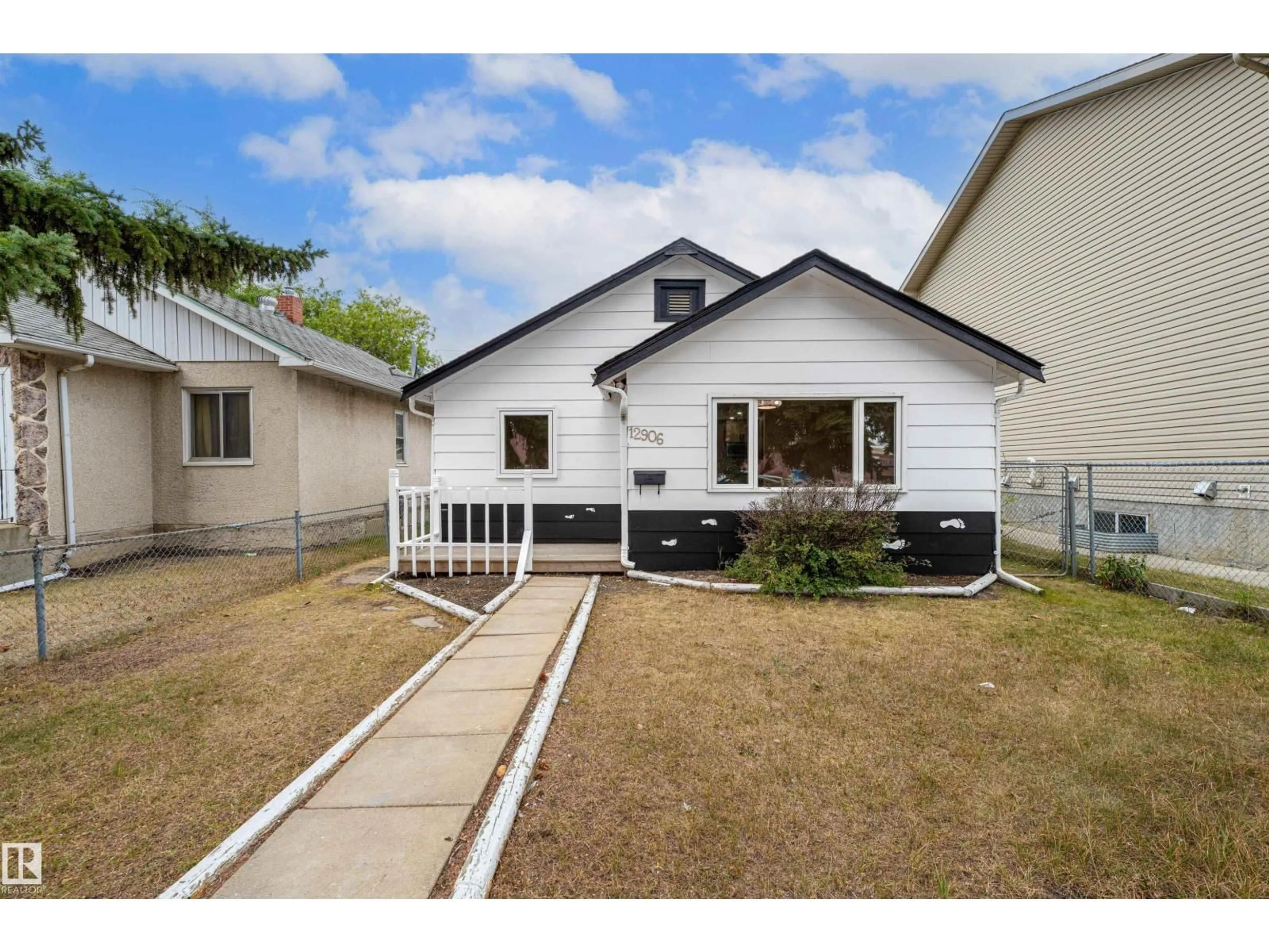 Home with vinyl exterior material, street for NW - 12906 128 ST, Edmonton Alberta T5L1E5