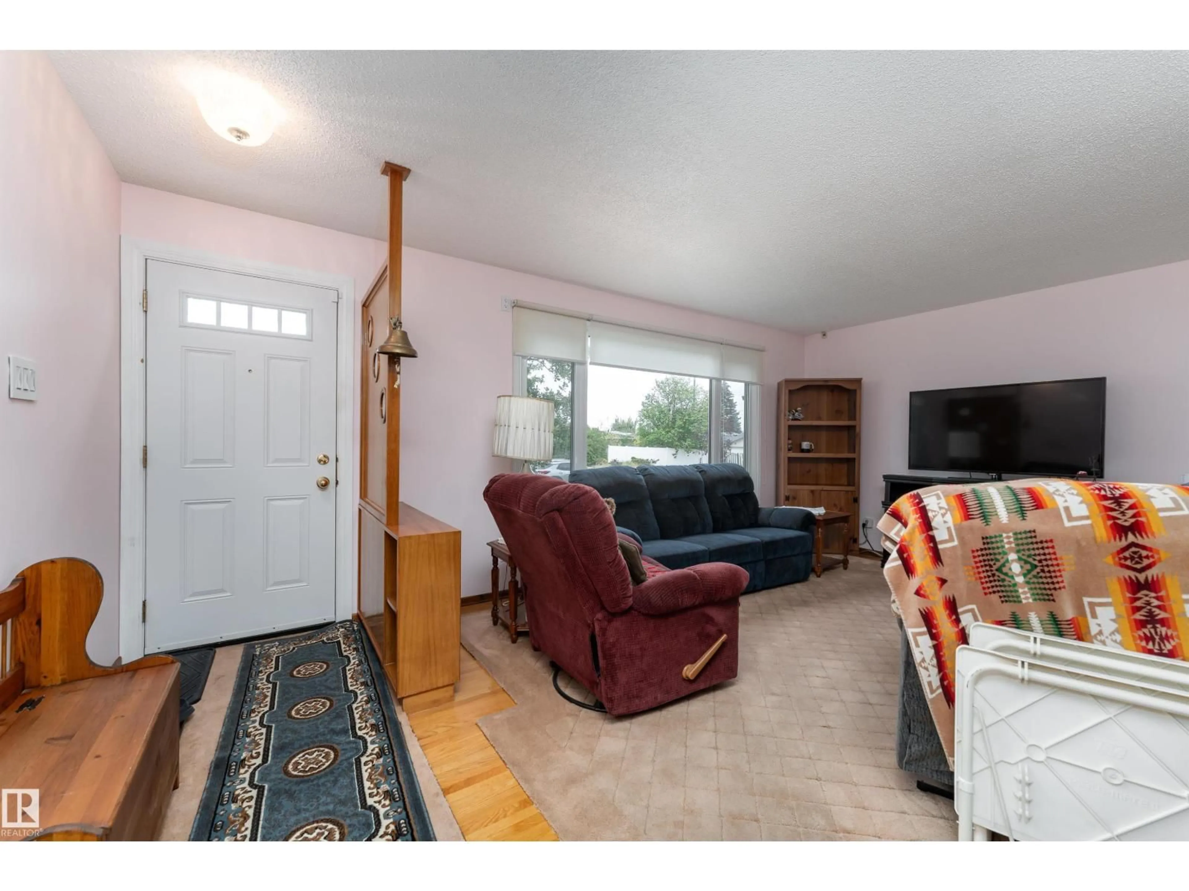 Living room with furniture, unknown for 8411 135 AV, Edmonton Alberta T5E1M9