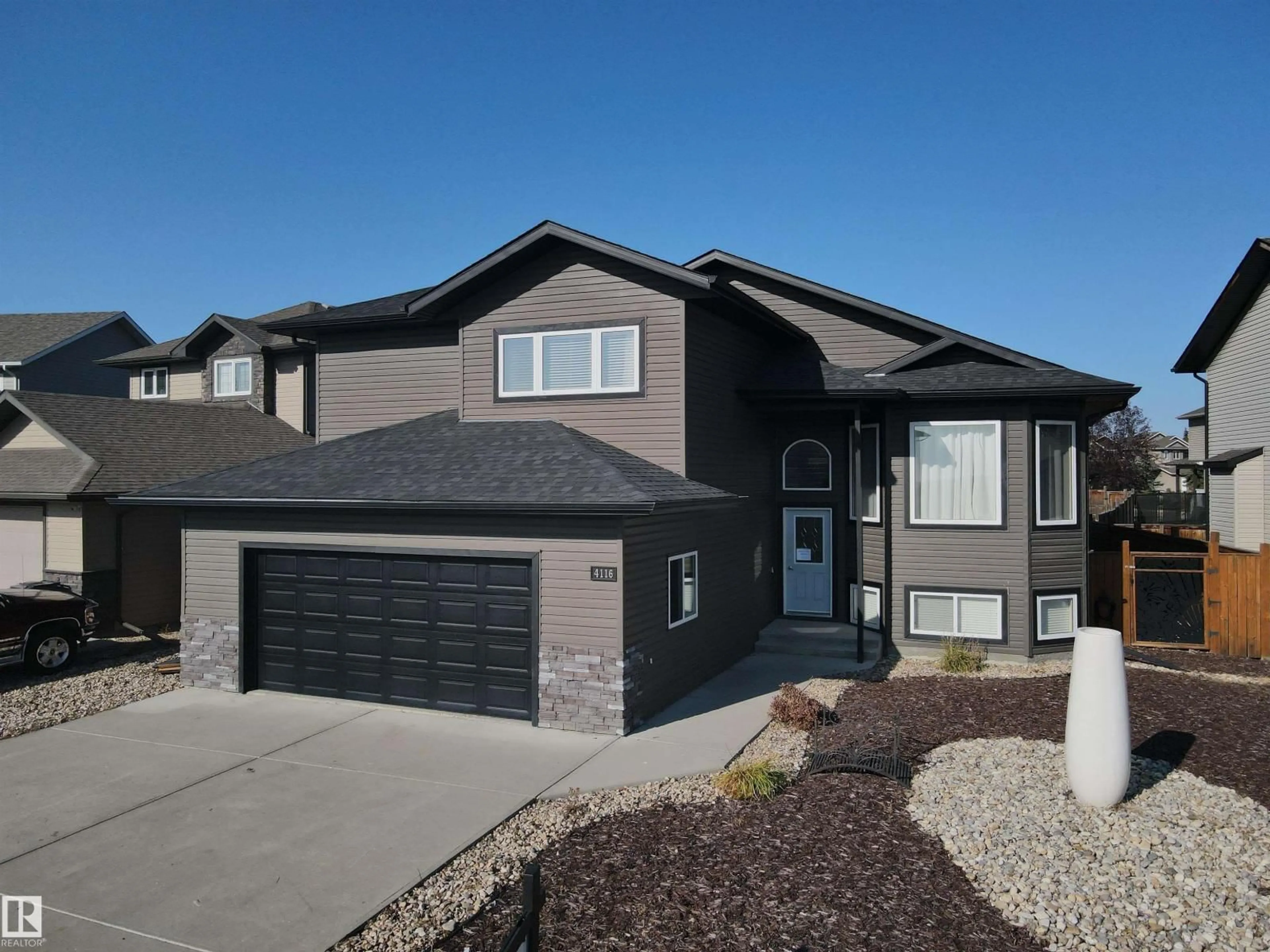 Home with vinyl exterior material, street for 4116 41 ST, Drayton Valley Alberta T7A1S2
