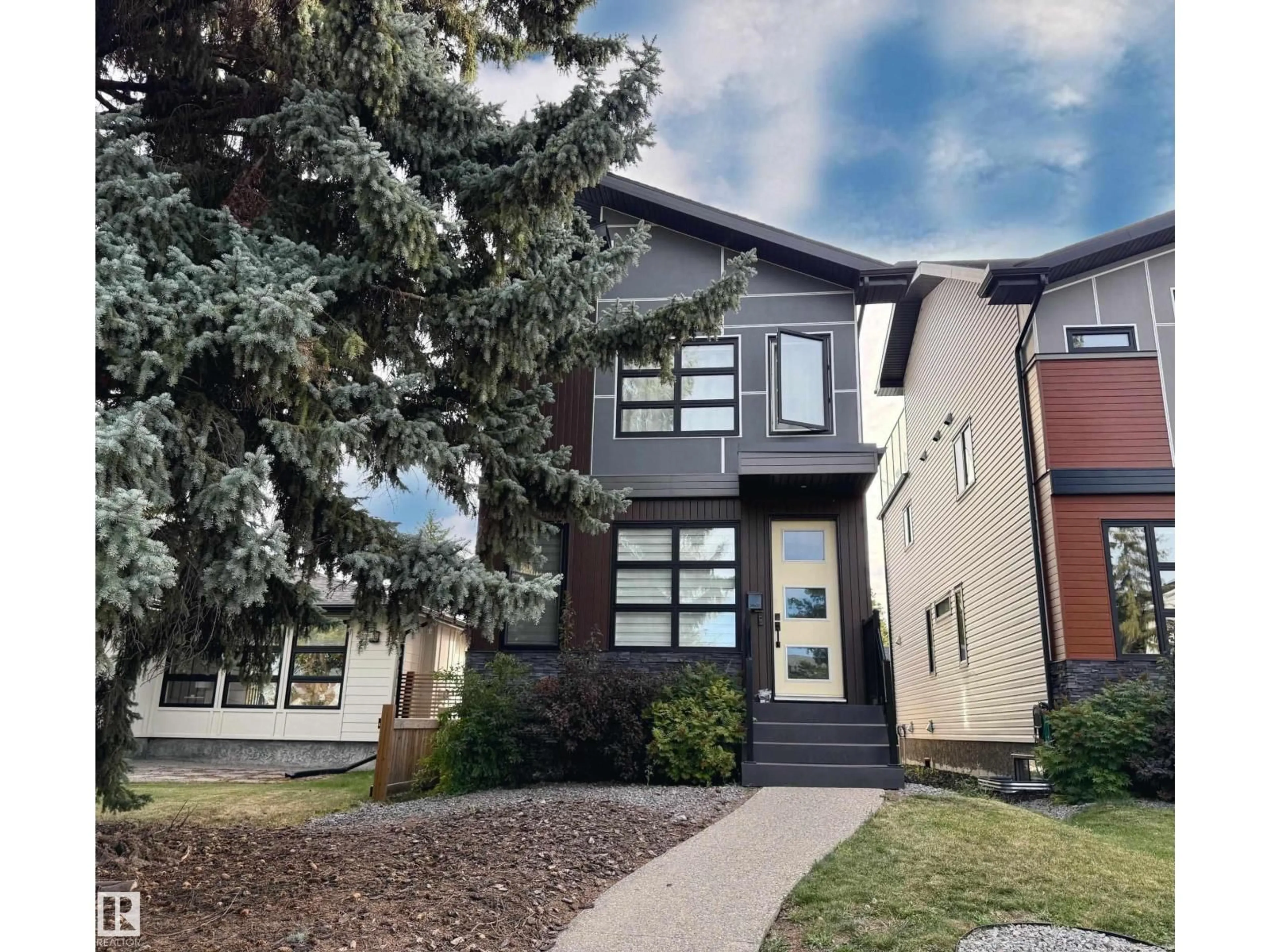 Home with vinyl exterior material, street for NW - 8809 148 ST, Edmonton Alberta T5R0Z8