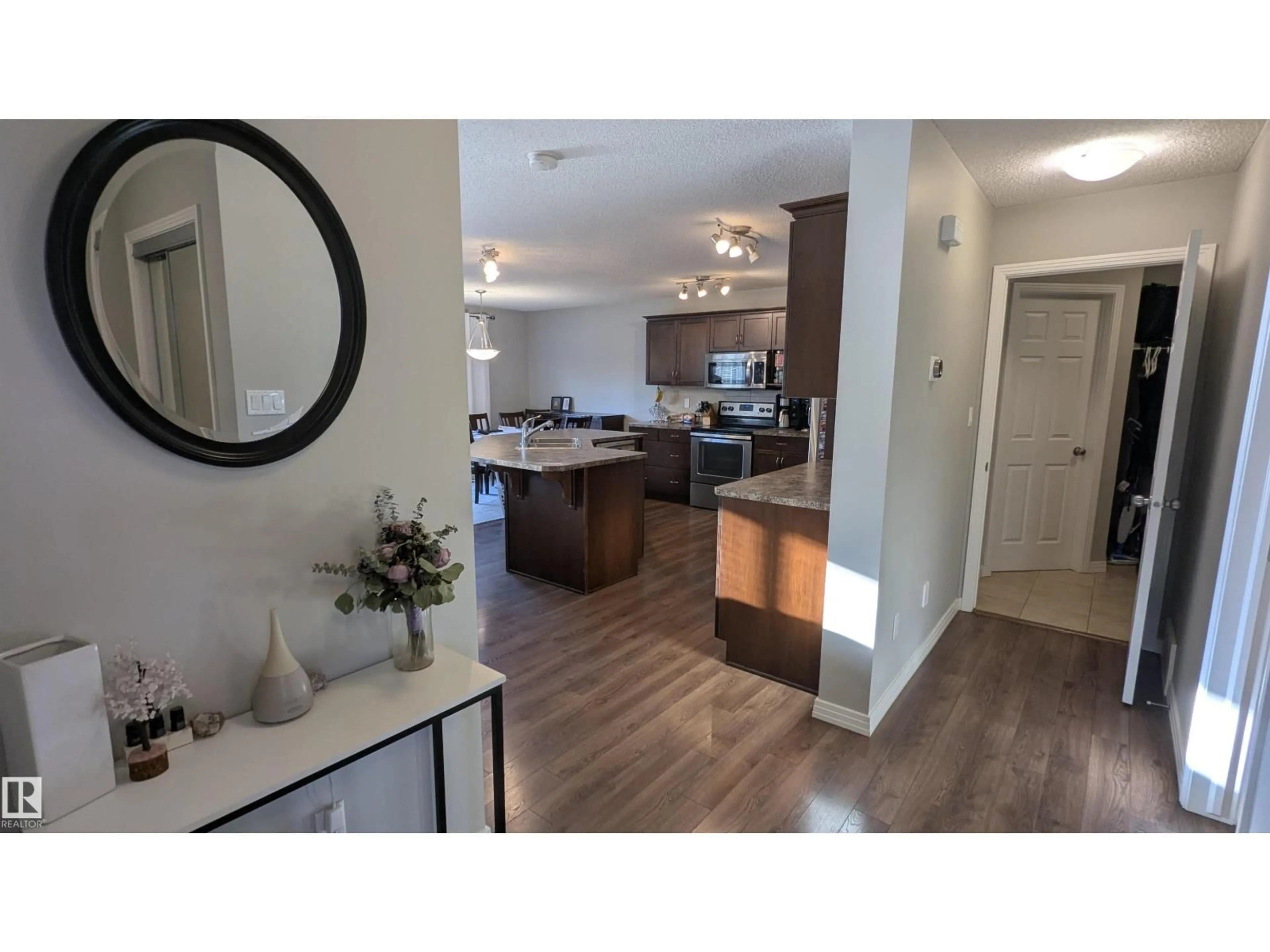 Open concept kitchen, wood/laminate floor for 16436 136 ST, Edmonton Alberta T6V0G8
